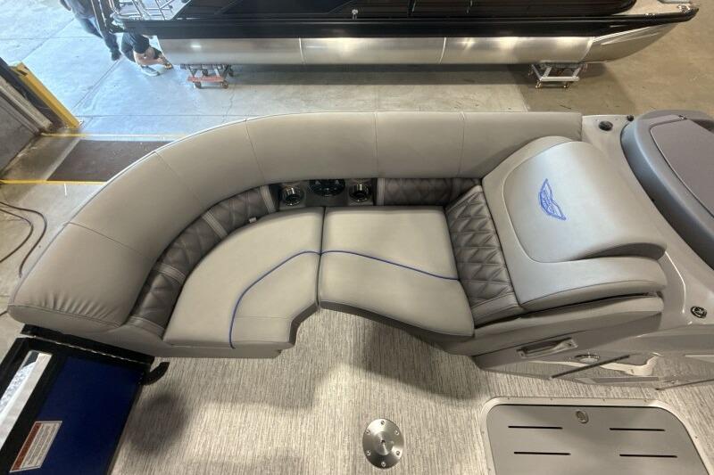 Luxurious seating on 2026 Bennington 23 LXS Swingback pontoon boat, featuring elegant gray upholstery.