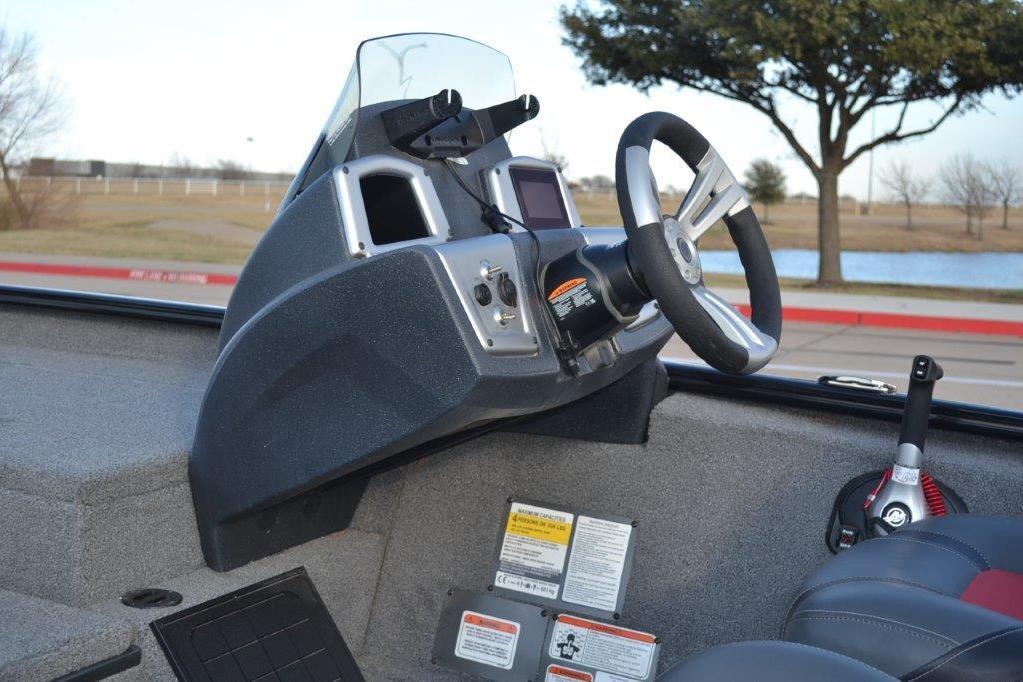 2025 Tracker Savage 215 boat dashboard with steering wheel and control panel.