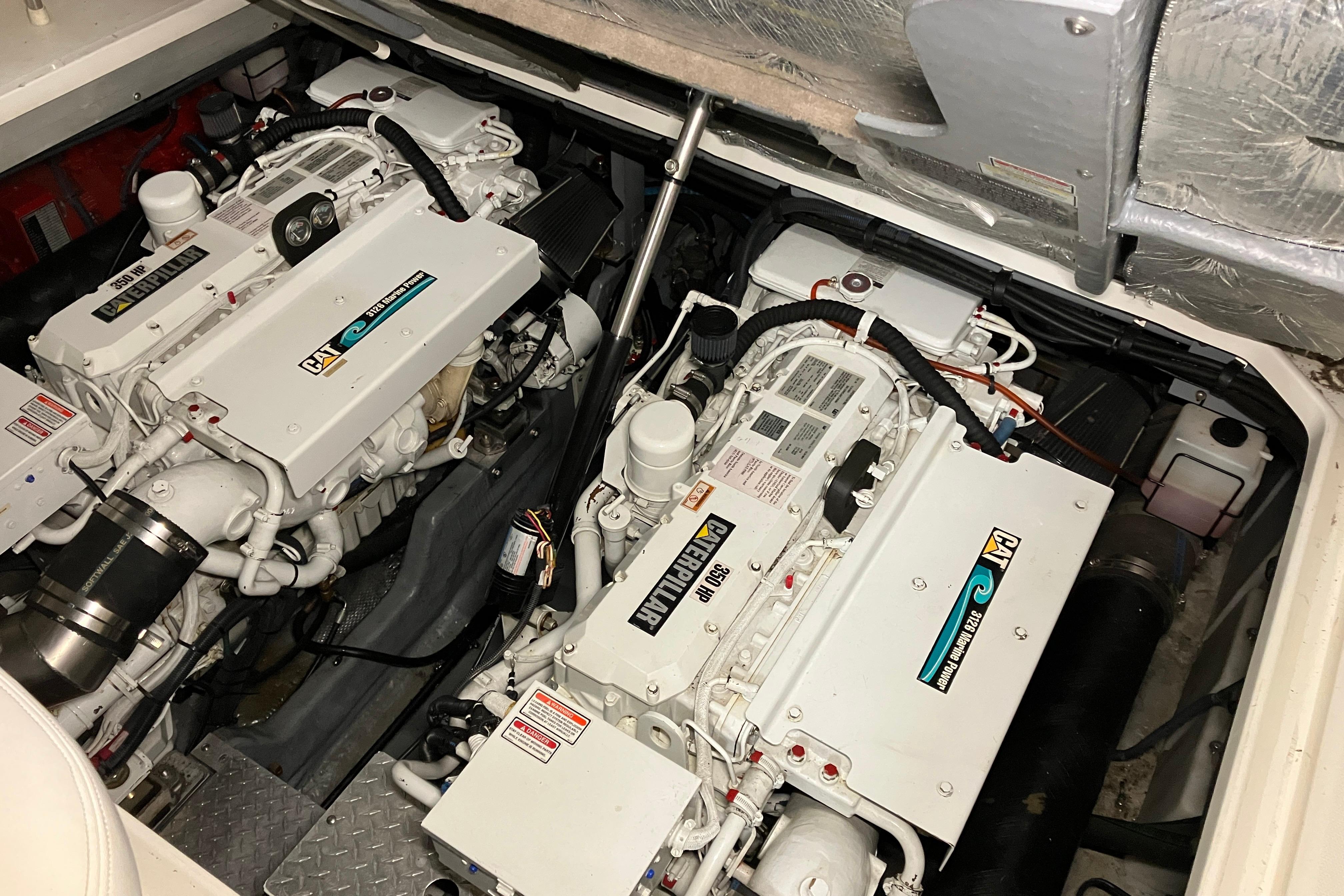 Engine compartment of a 2002 Sea Ray 410 Sundancer with dual Caterpillar engines.