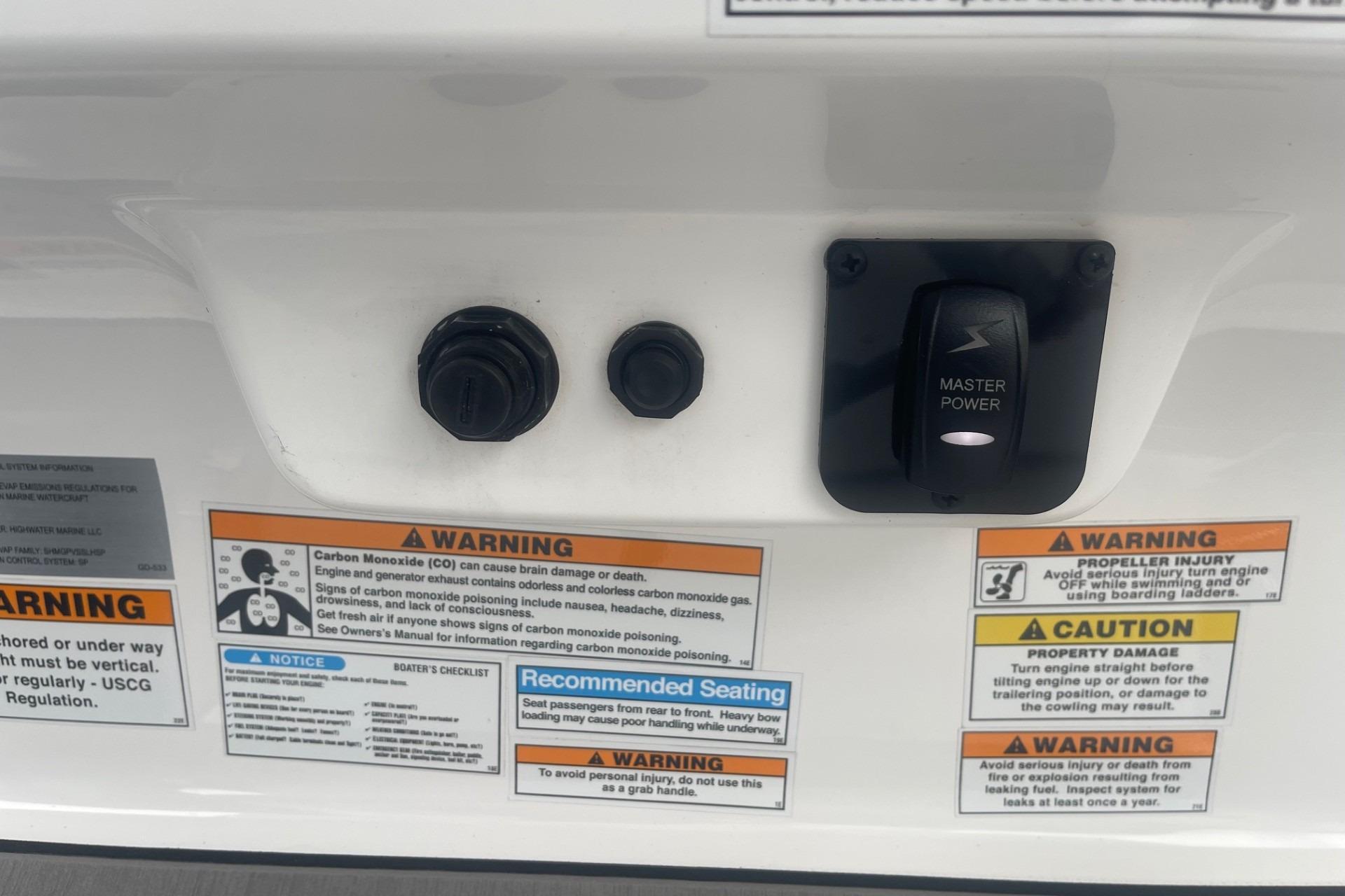 Control panel with warnings on a 2025 Hurricane Center Console 24 OB boat.