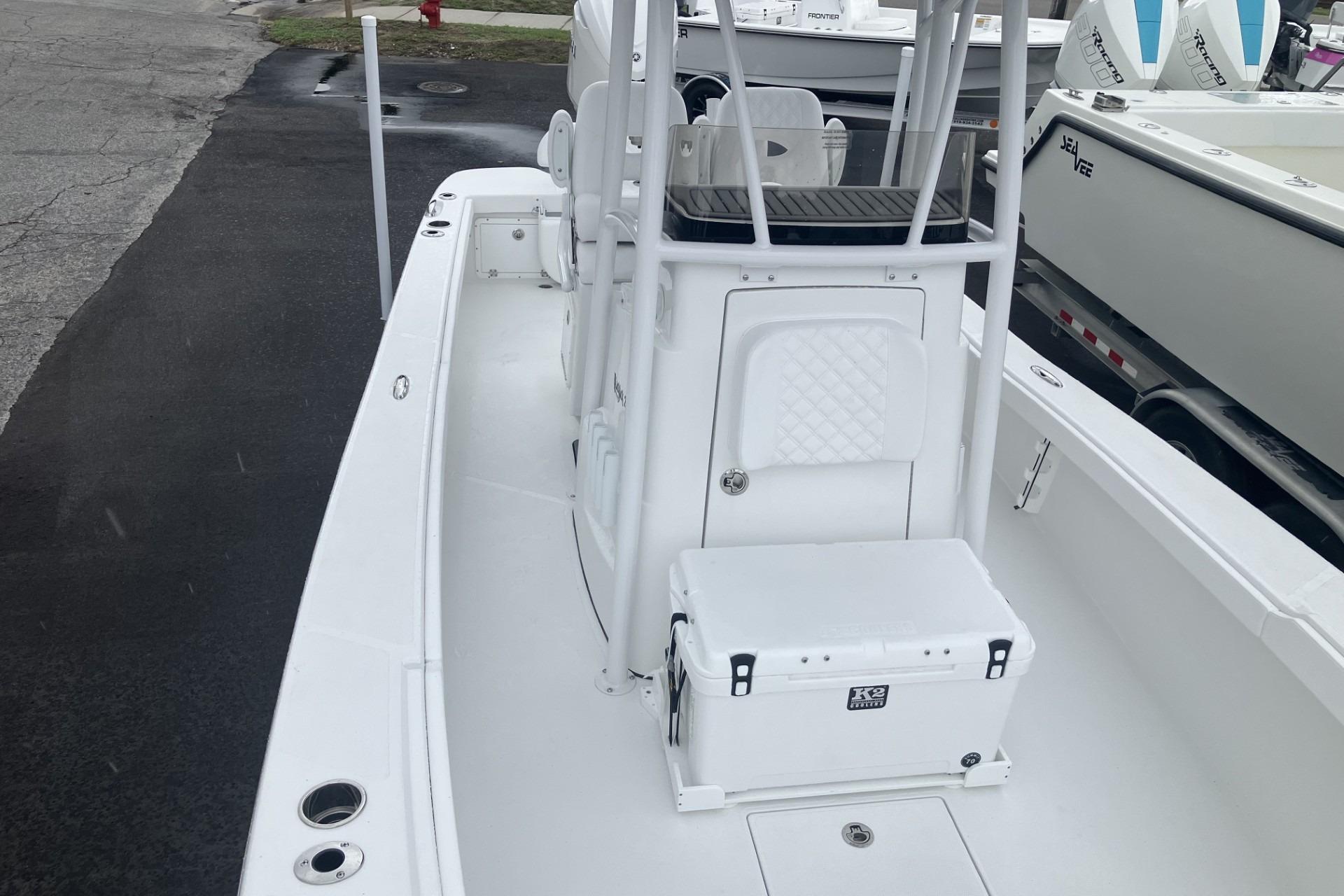 2026 BlackJack 256 Coastal boat interior with seating and storage compartments.