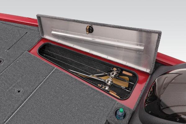 Fishing rods are stored in a compartment of a Tracker Pro Team 175 TXW boat.