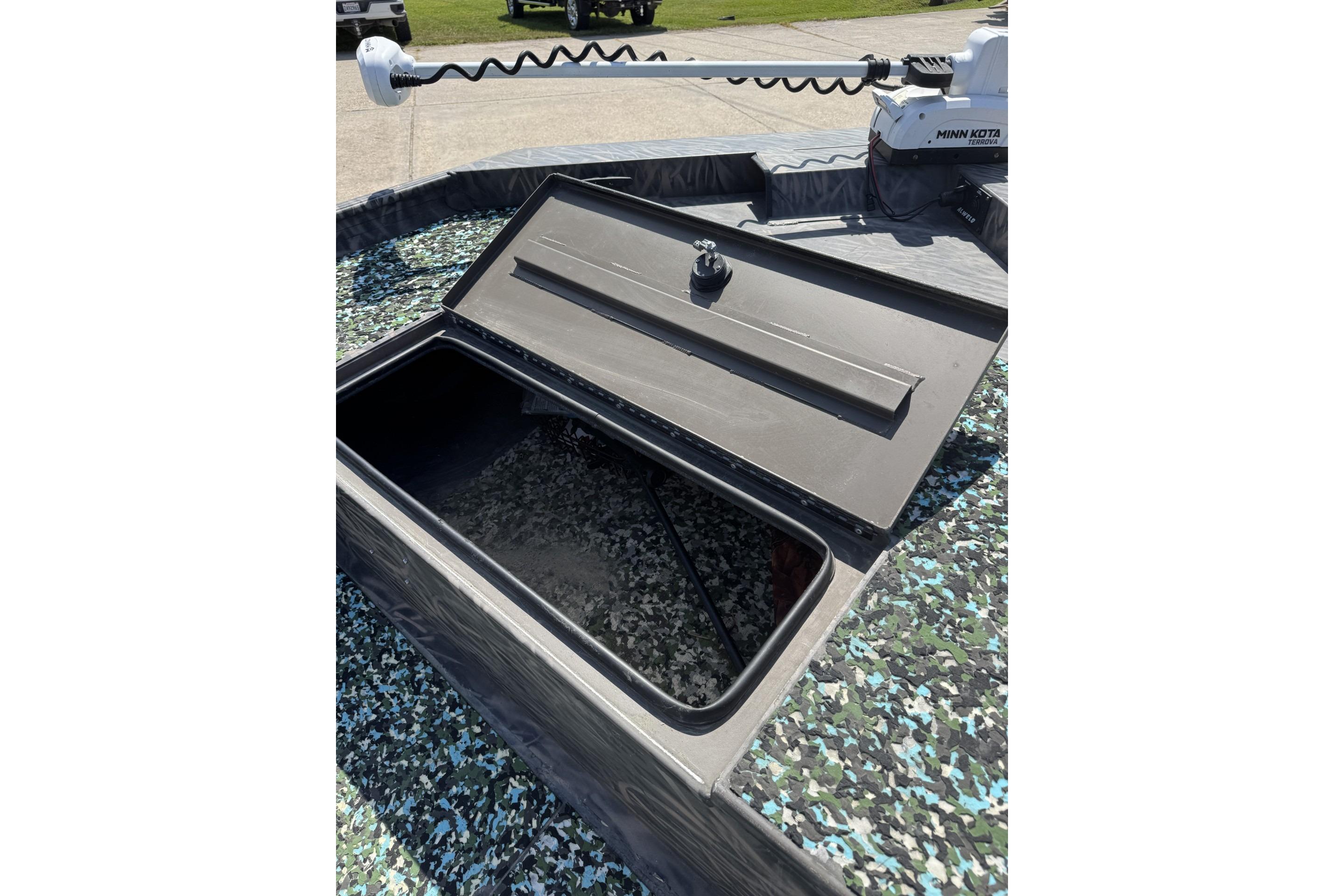 Open storage compartment on 2022 Alweld 2270 Large Flat Bottom boat with Minn Kota motor.