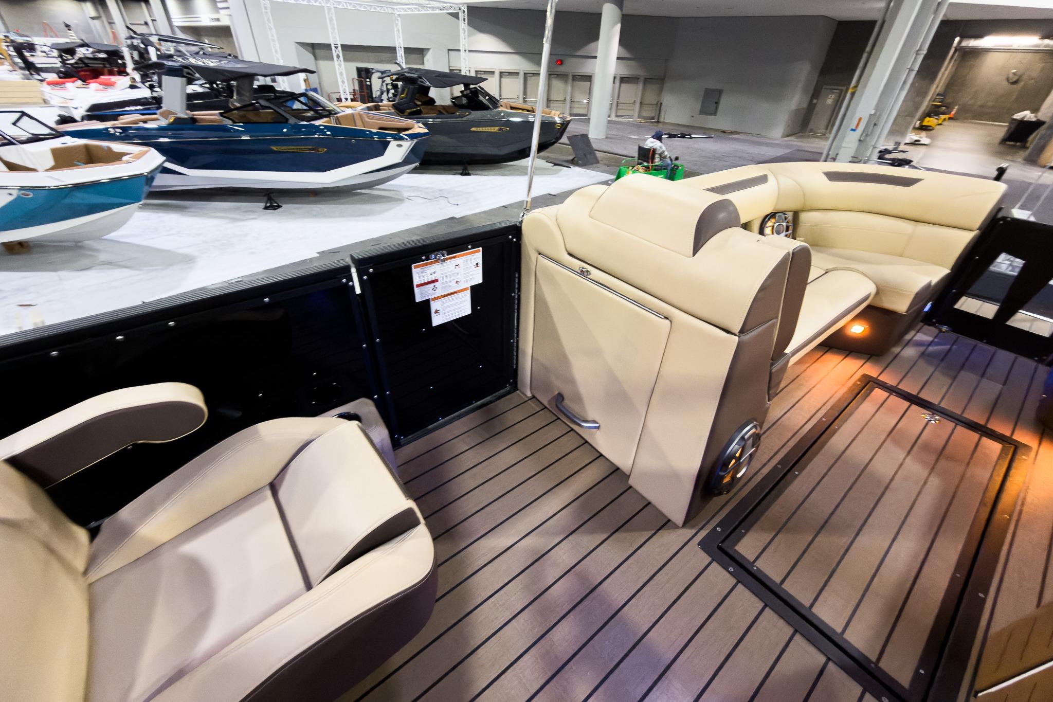 Luxurious interior of 2026 Montara Surf Boss EVO SLDH 25' boat at a showroom.