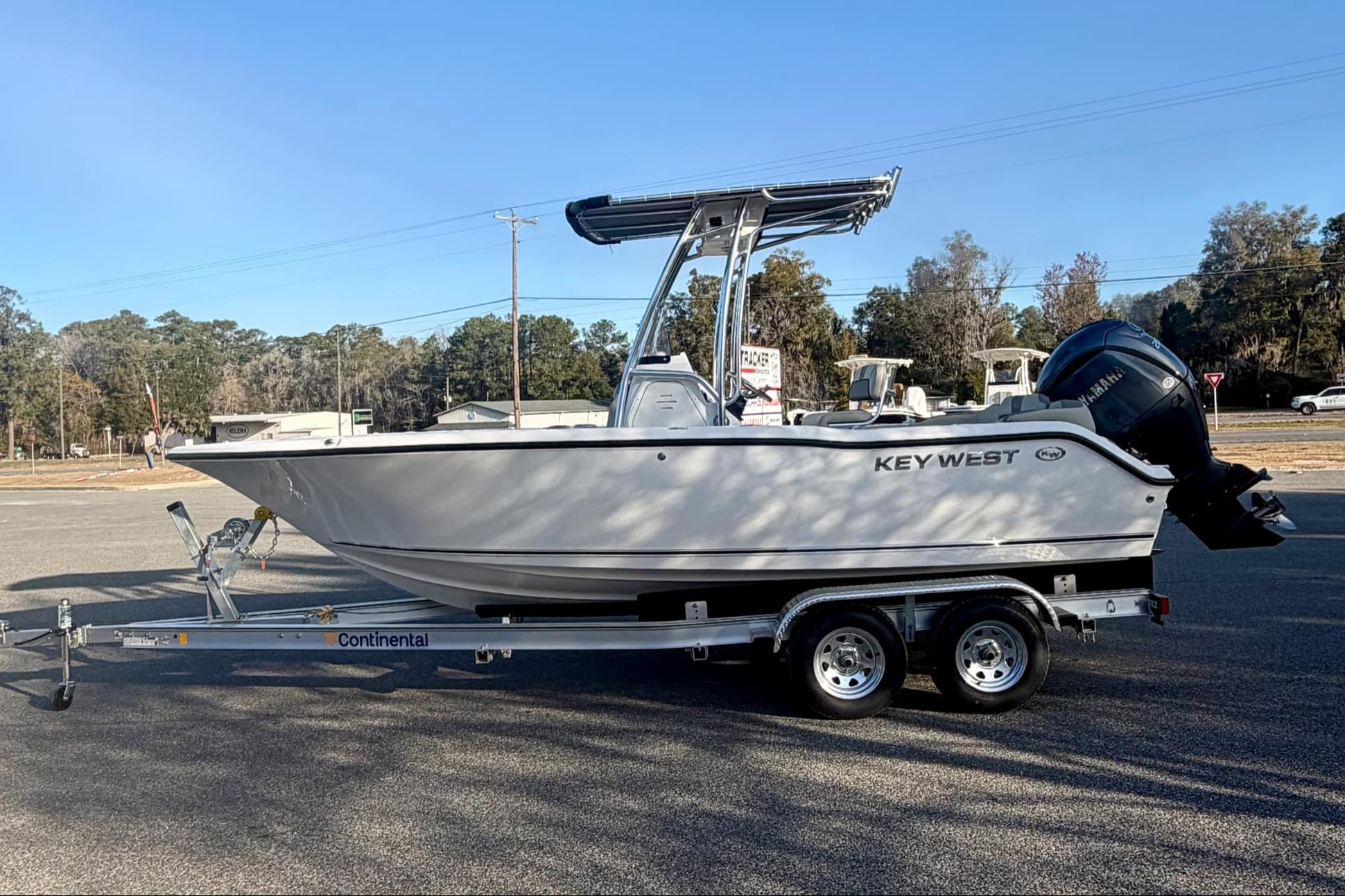 2026 Key West 203 FS boat on trailer, side view in outdoor setting.