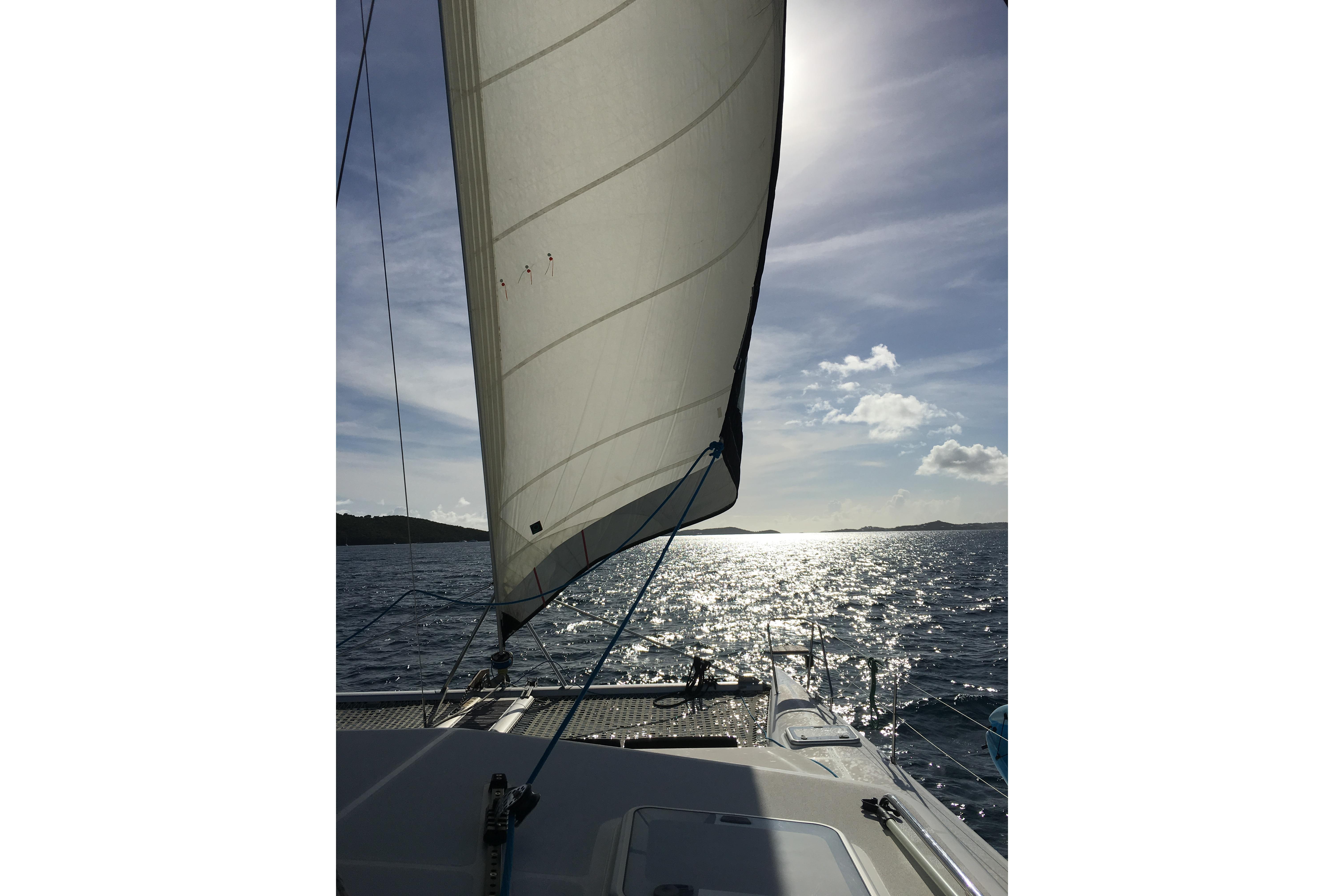 Sailing on a 2011 Voyage Yachts 520, sunlit ocean view.