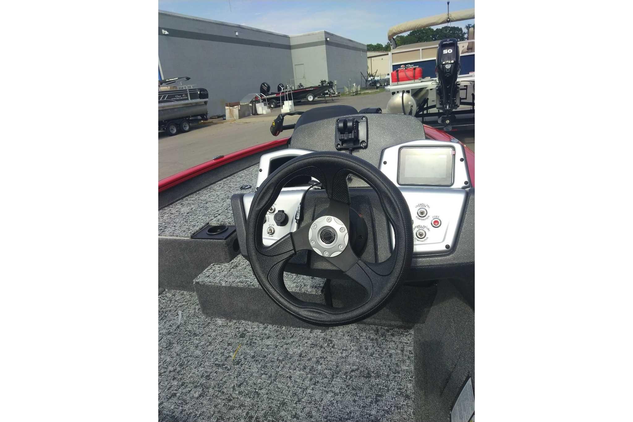 Steering console of a 2026 Tracker Pro Team 190 boat, featuring modern controls and dashboard.