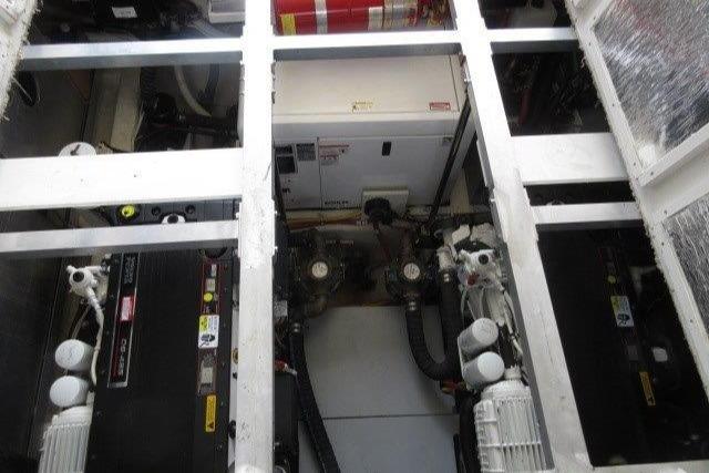 Engine room of 2008 Carver 47 Motor Yacht, showcasing machinery and equipment.