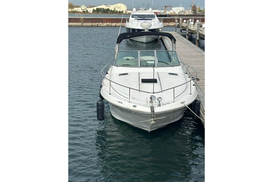 2000 Sea Ray Sundancer 310 docked at marina, front view.