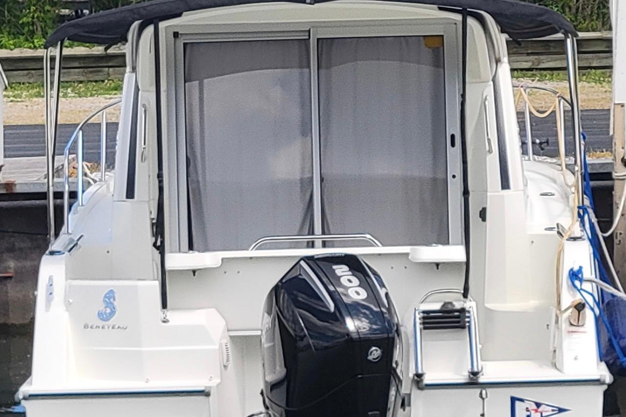 2019 Beneteau Antares 23 boat with outboard motor, docked at marina.