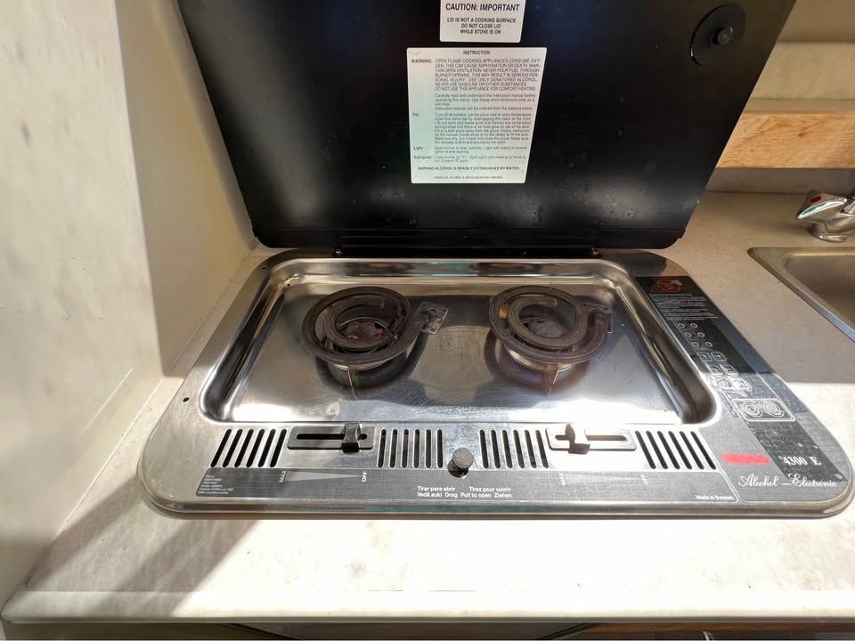 1999 Bayliner 2452 boat kitchen area with stove.