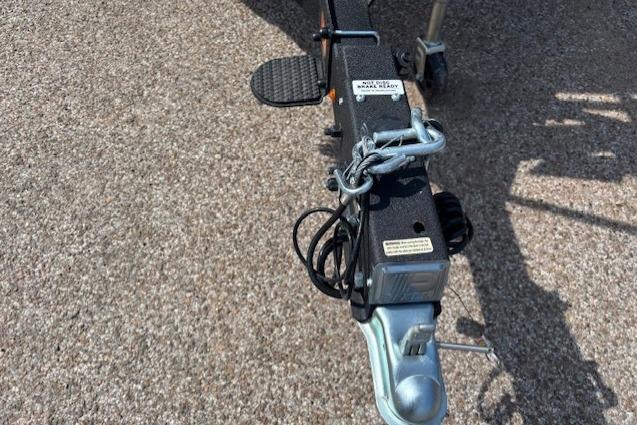 Trailer hitch of a 2026 Sun Tracker Party Barge 20 DLX on pavement.
