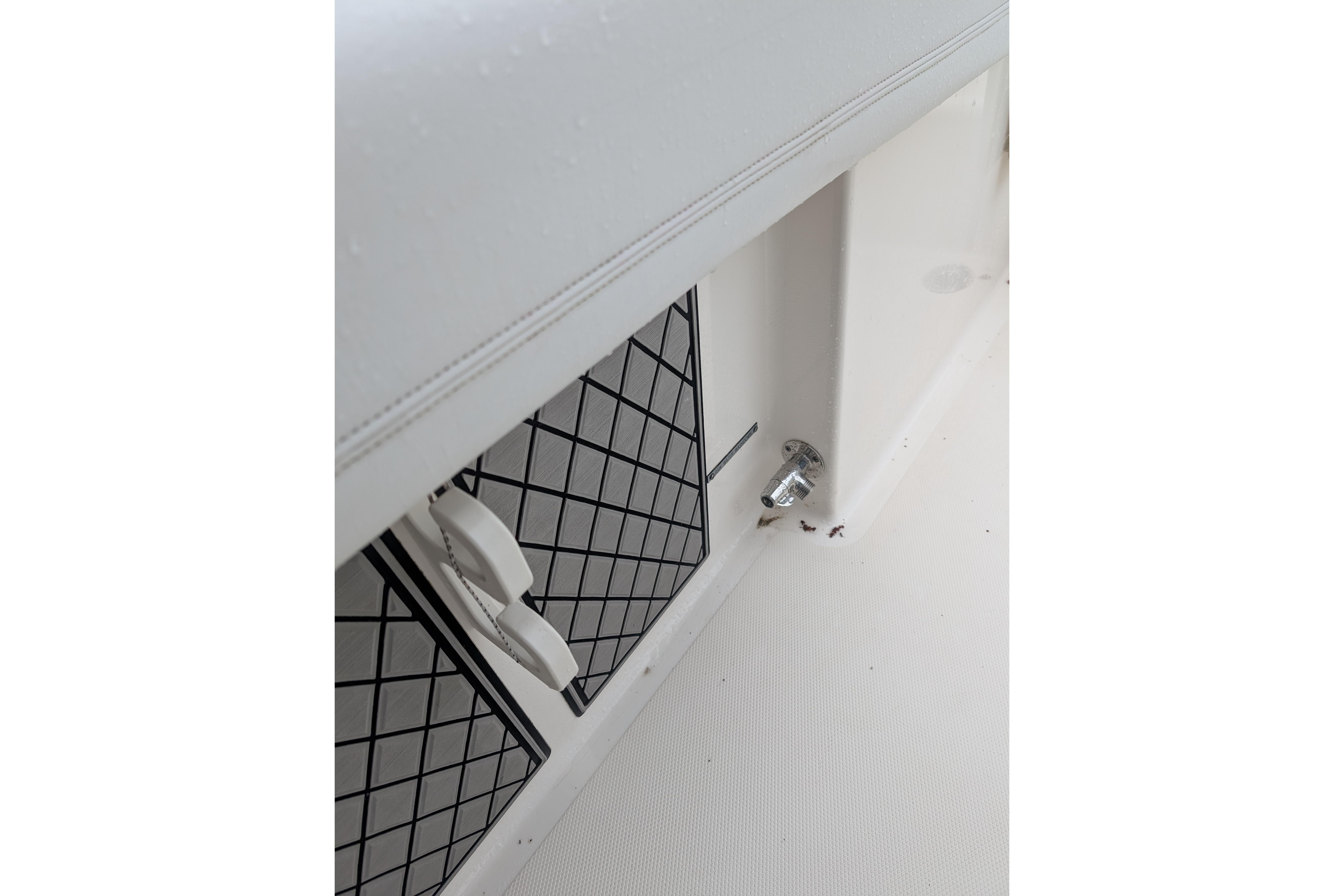 2019 Wellcraft 222 Fisherman boat interior detail with storage compartments.