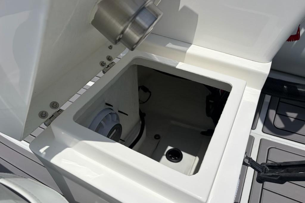 Open storage compartment on 2026 Highfield Classic 360 boat, showcasing interior details.