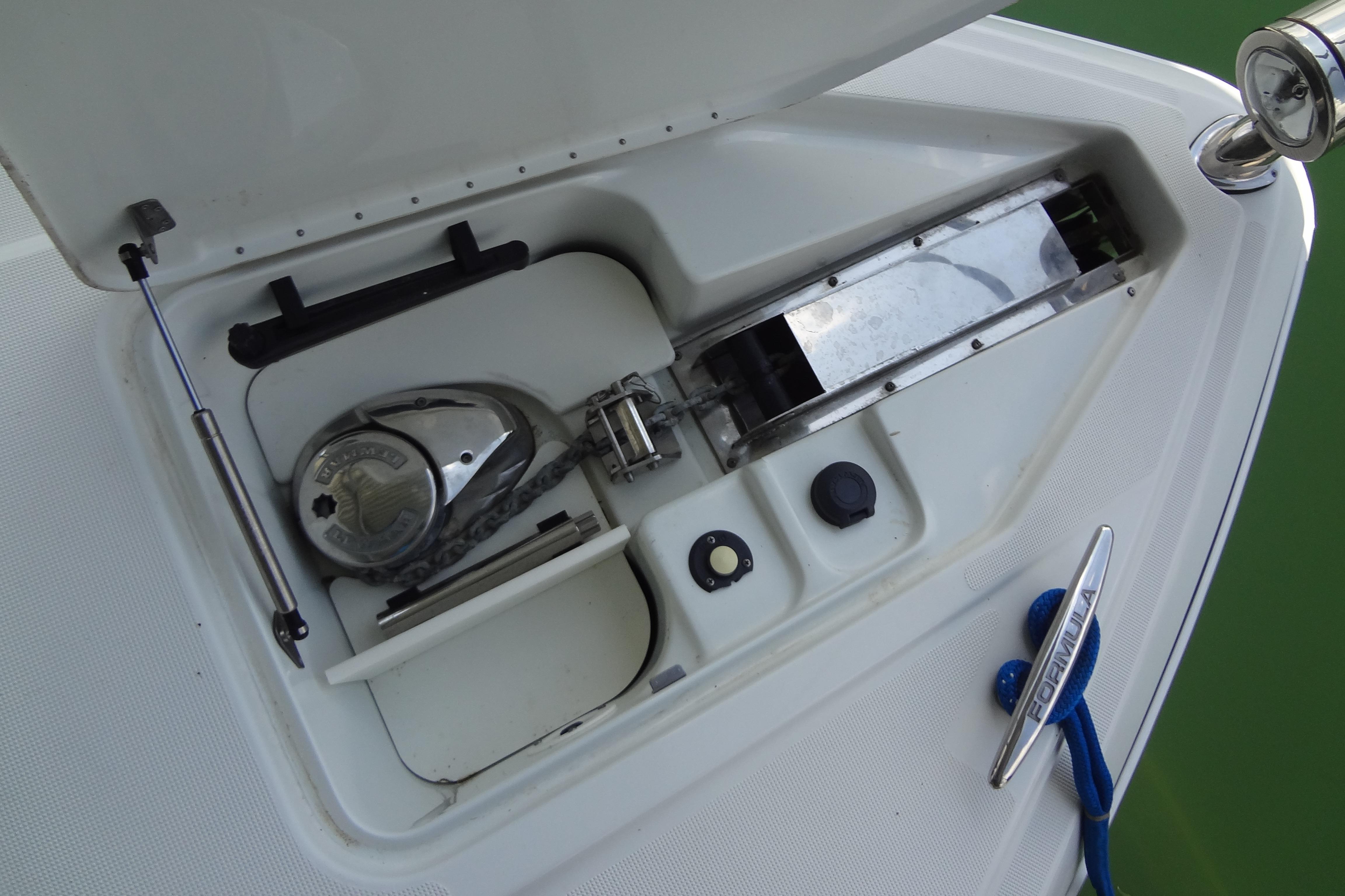 Anchor compartment of a 2007 Formula 34 Performance Cruiser with visible chain and winch.