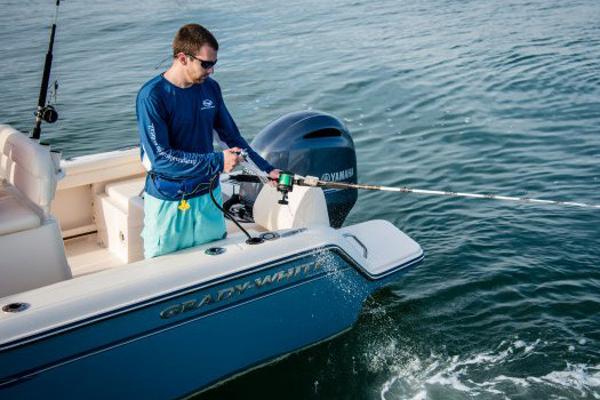Manufacturer Provided Image: Man fishing on a 2018 Grady-White Fisherman 216 boat in open water.