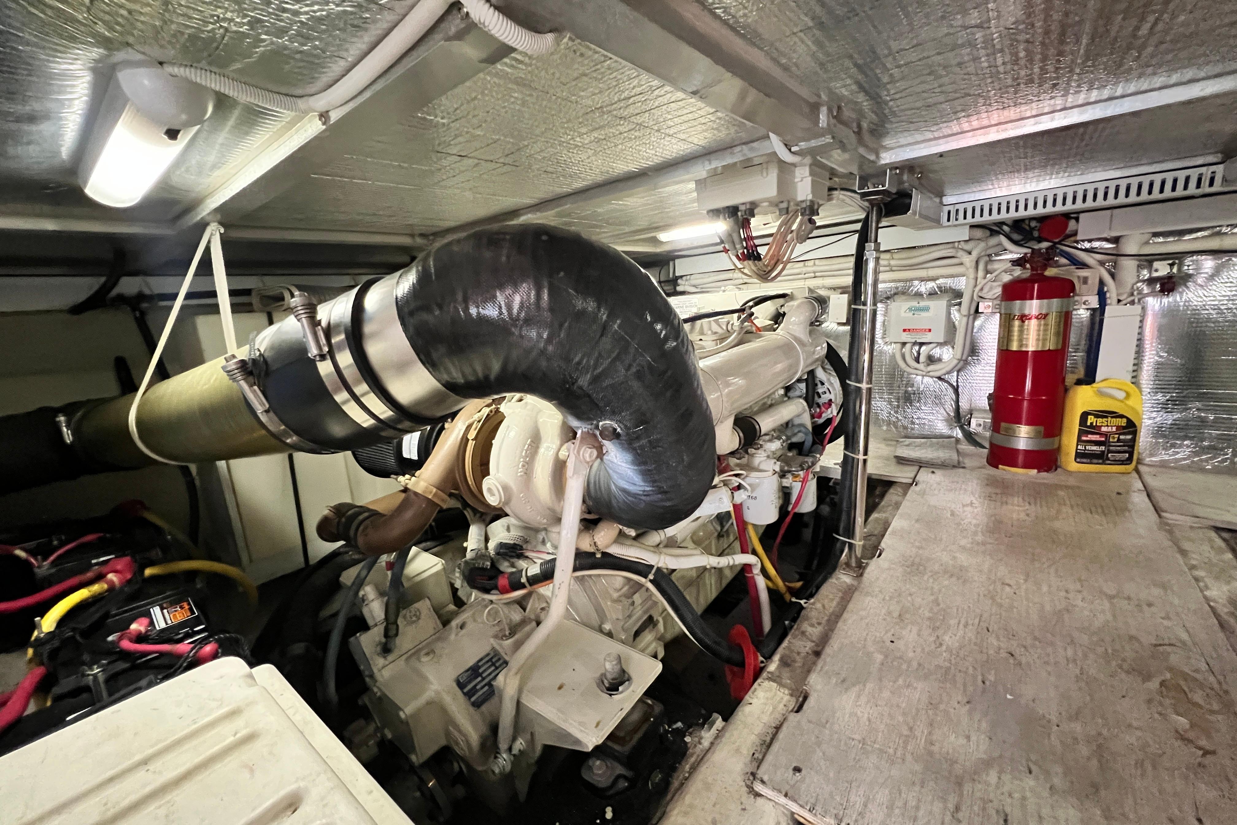 Engine room of 2003 Carver 450 Voyager Pilothouse with visible machinery and equipment.
