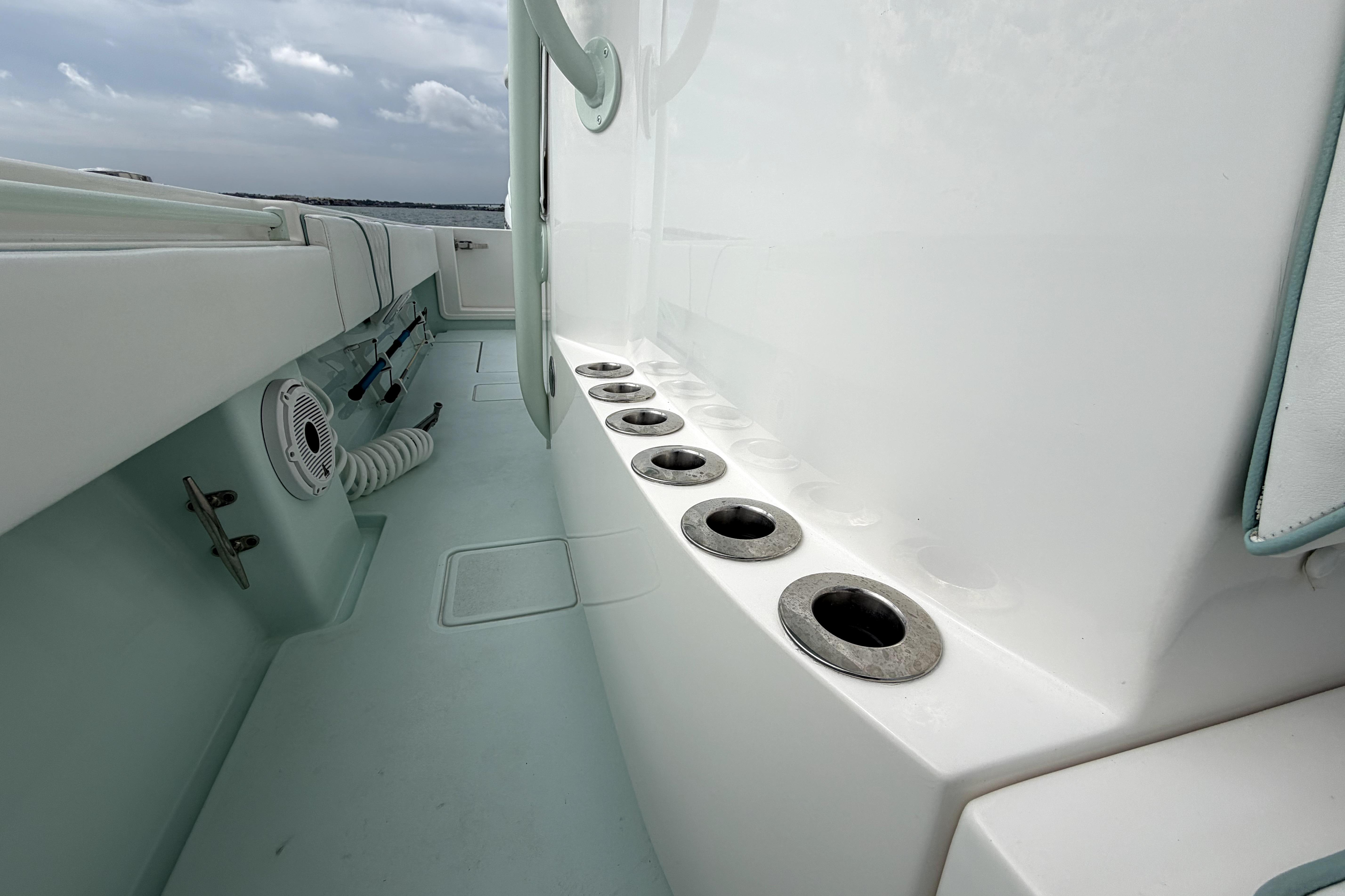 2019 Contender 30 ST boat interior with rod holders and storage compartments.