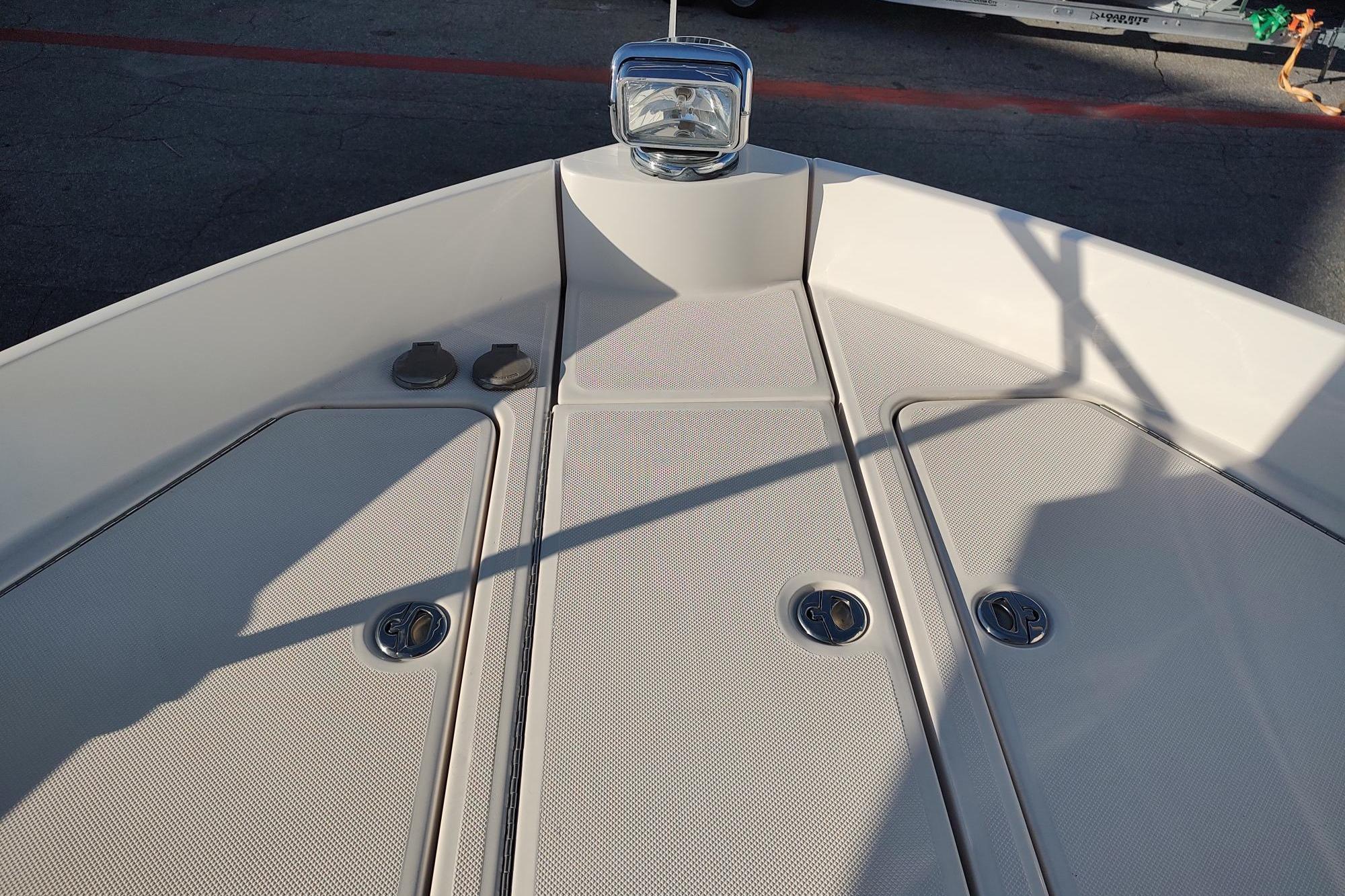 Bow of 2021 Regal 42 Fly yacht with sleek deck design and fixtures.