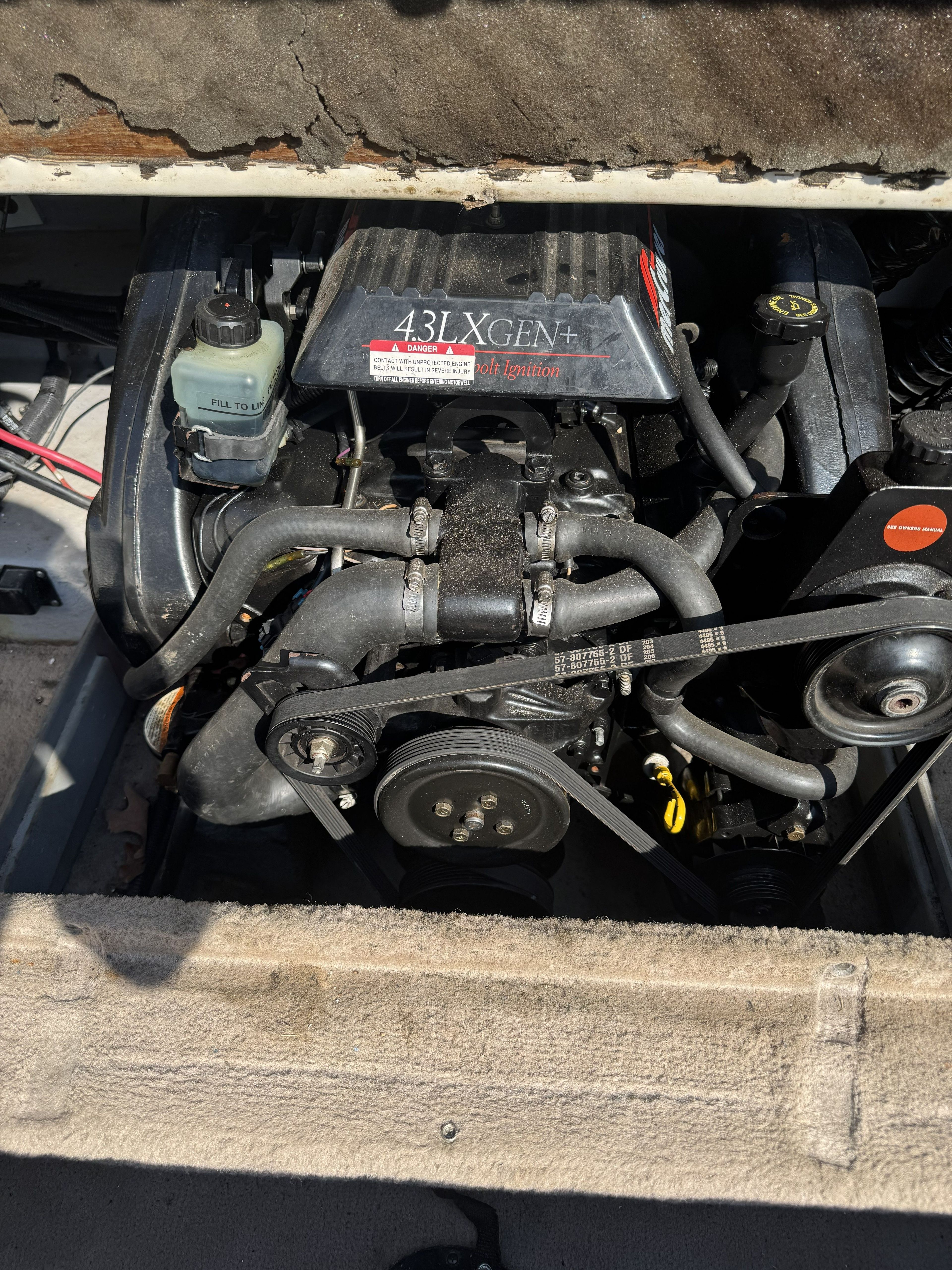 An engine compartment with a 43LX GEN+ engine in a 1996 Chaparral 1830 SS boat.