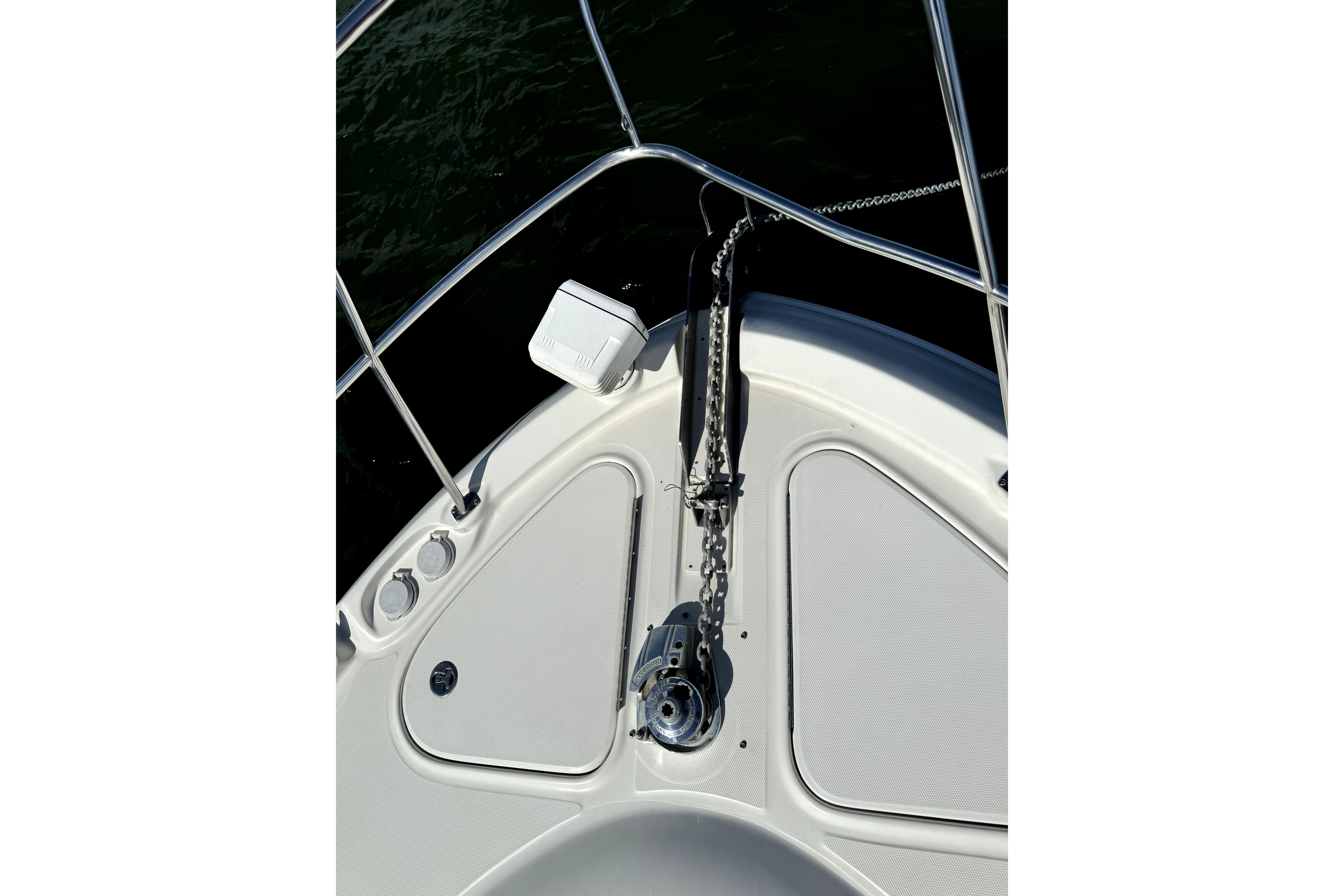 Bow of 2005 Sea Ray 580 Sedan Bridge with anchor chain and railing.