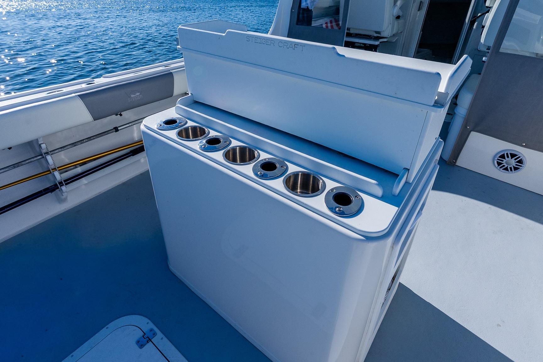 2024 Steiger Craft 31 Fisherman boat deck with rod holders and storage.