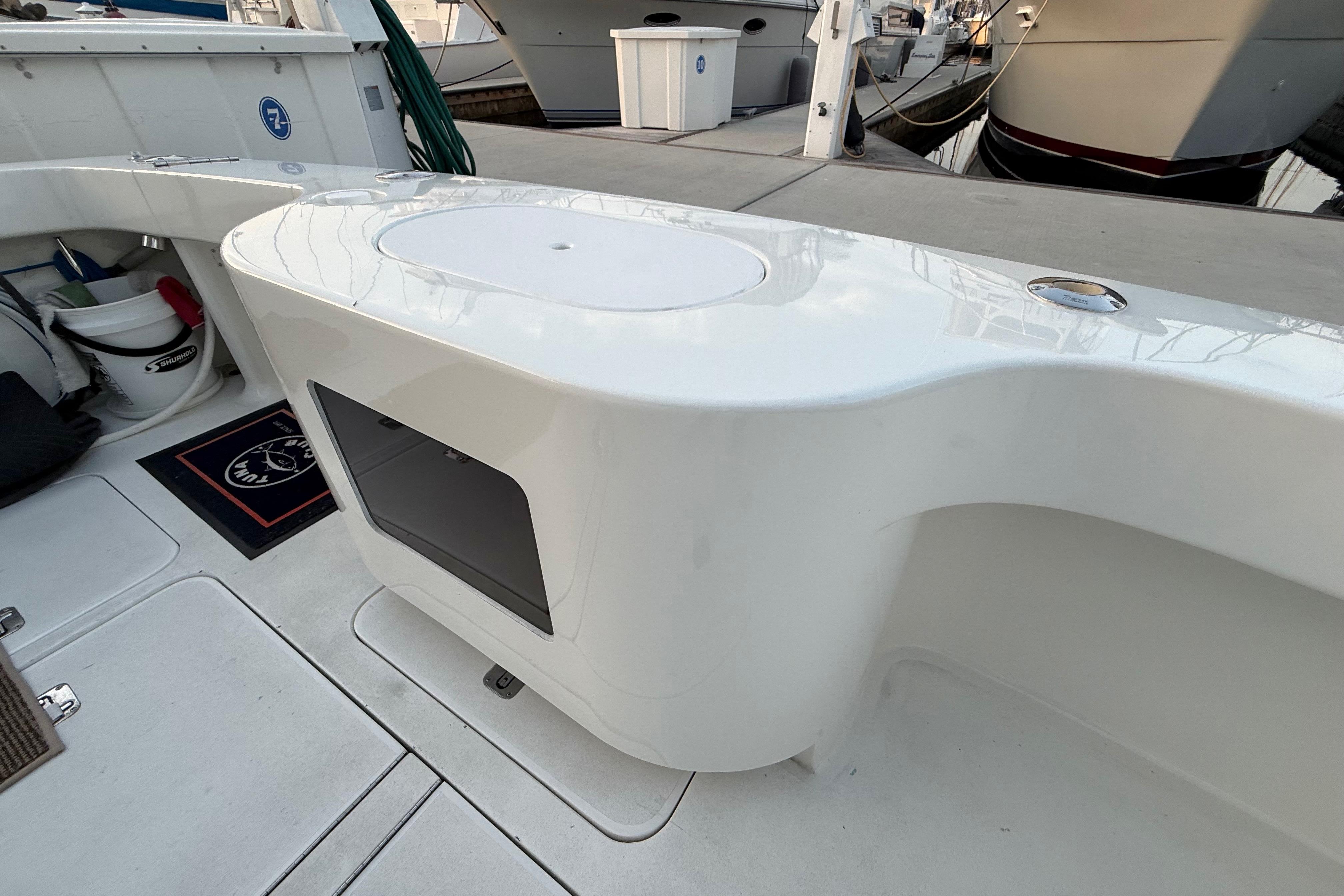 2002 Viking 48 Convertible yacht deck with storage and seating area.