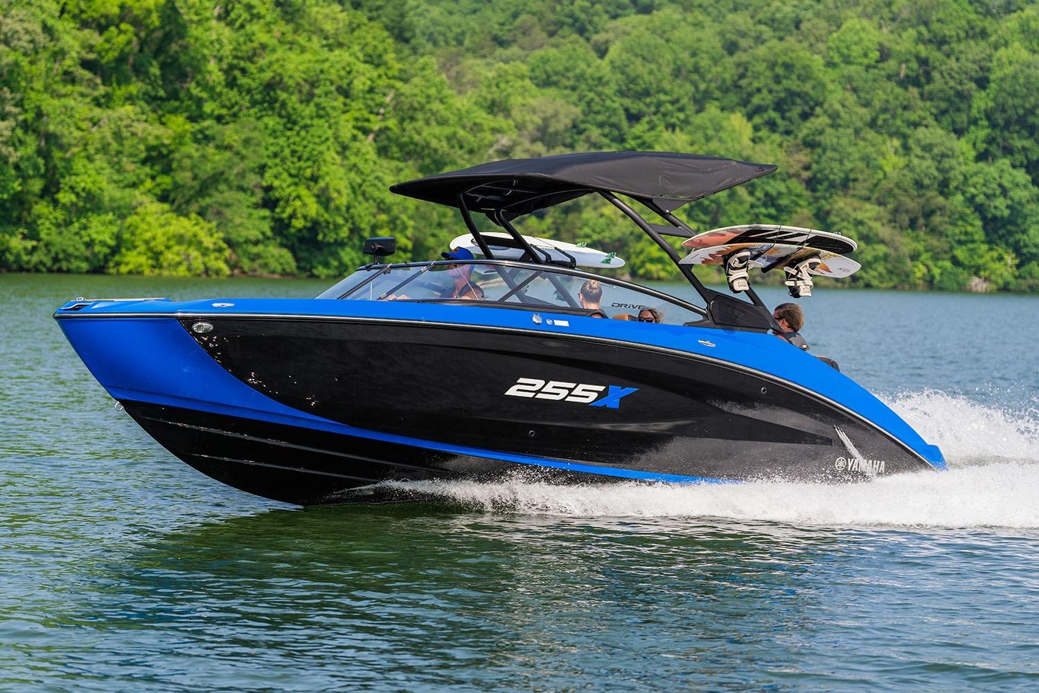 Manufacturer Provided Image: 2026 Yamaha Boats 255XD cruising on a lake with lush green background.