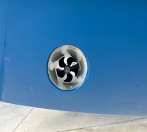 Close-up of a 2022 Yellowfin 39 Offshore boat's blue hull with a thruster.