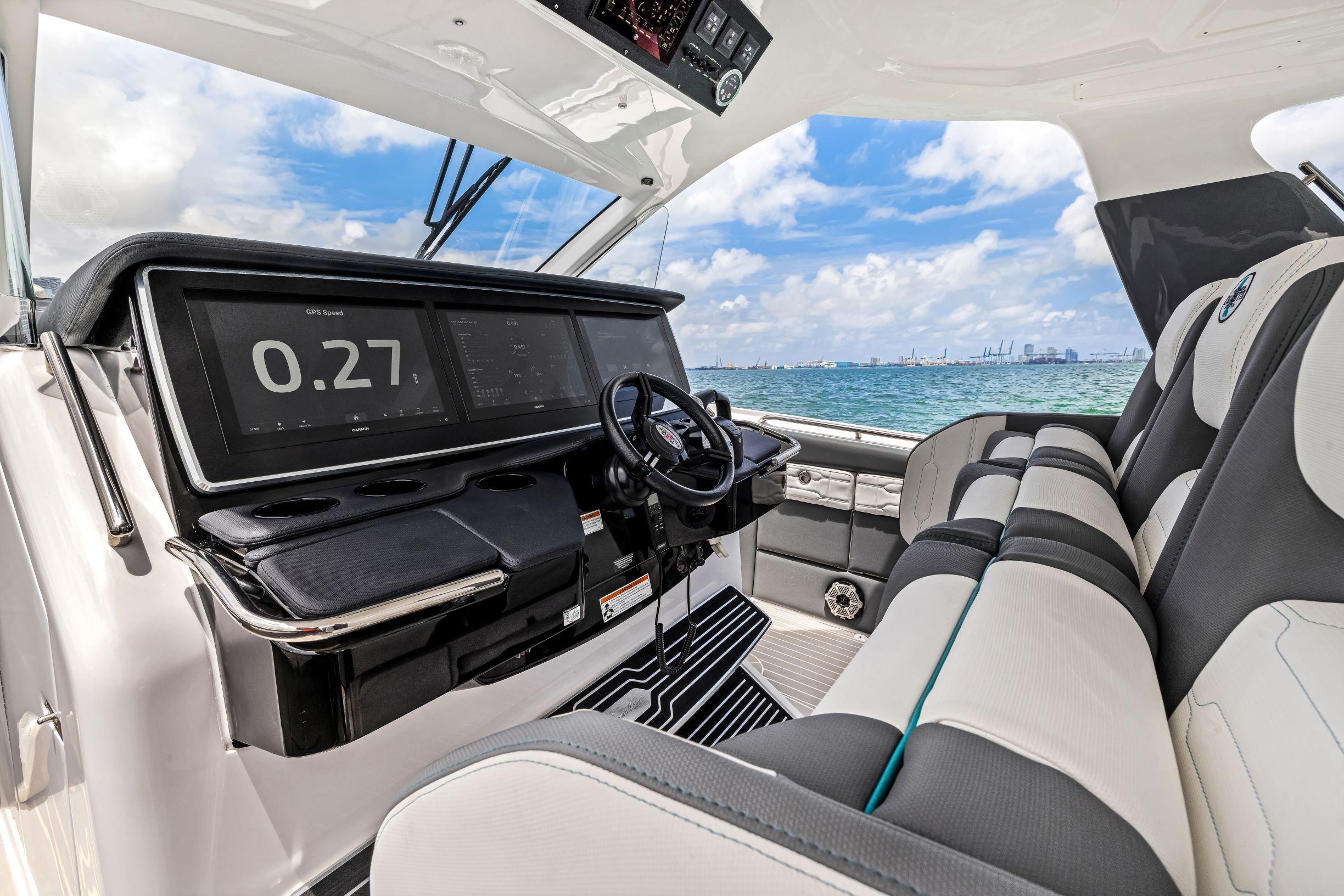 Interior of 2022 Cigarette 42 Auroris boat with modern dashboard and ocean view.