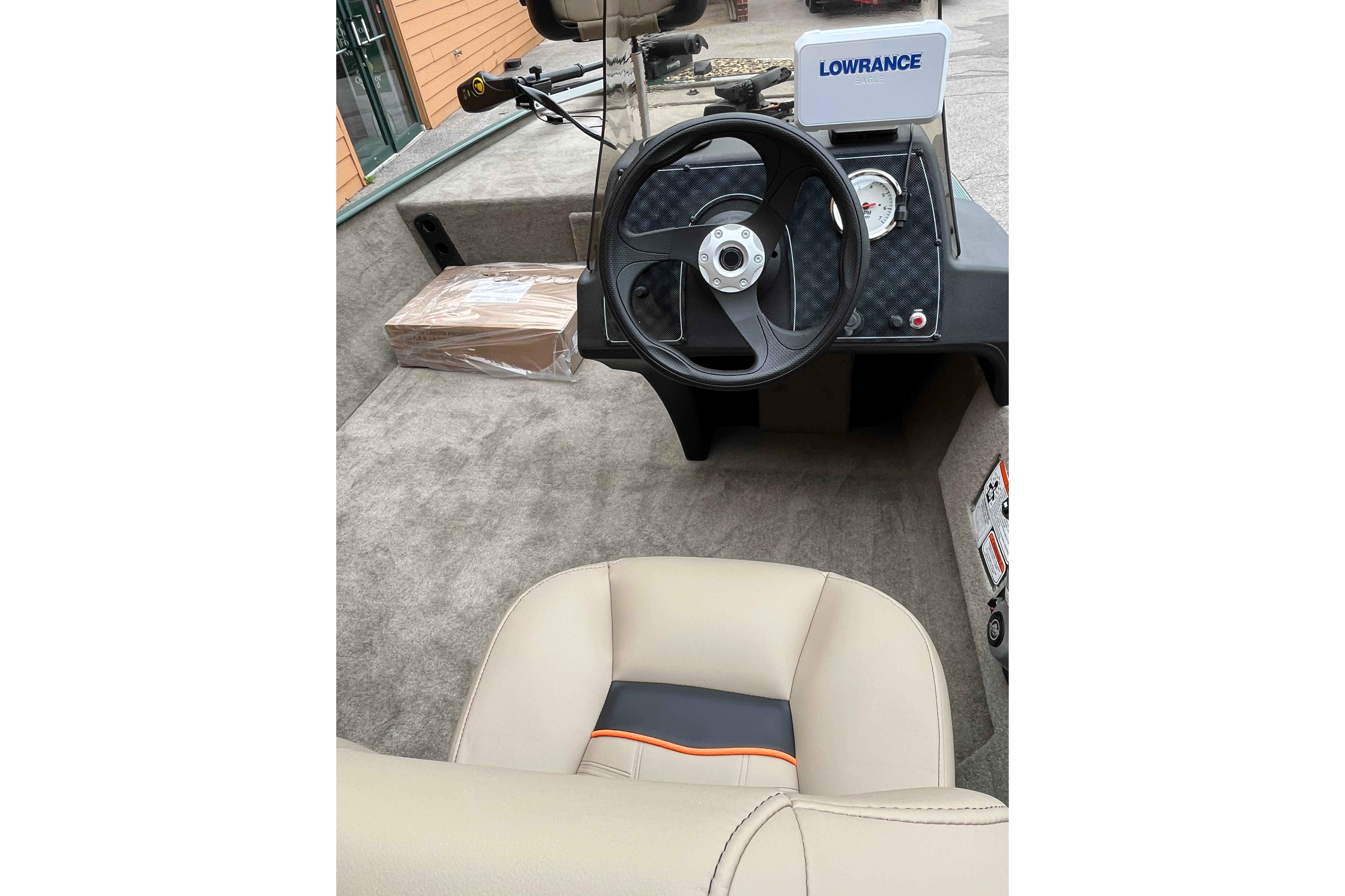 2026 Tracker Bass Tracker Classic Limited boat interior with steering wheel and Lowrance electronics.
