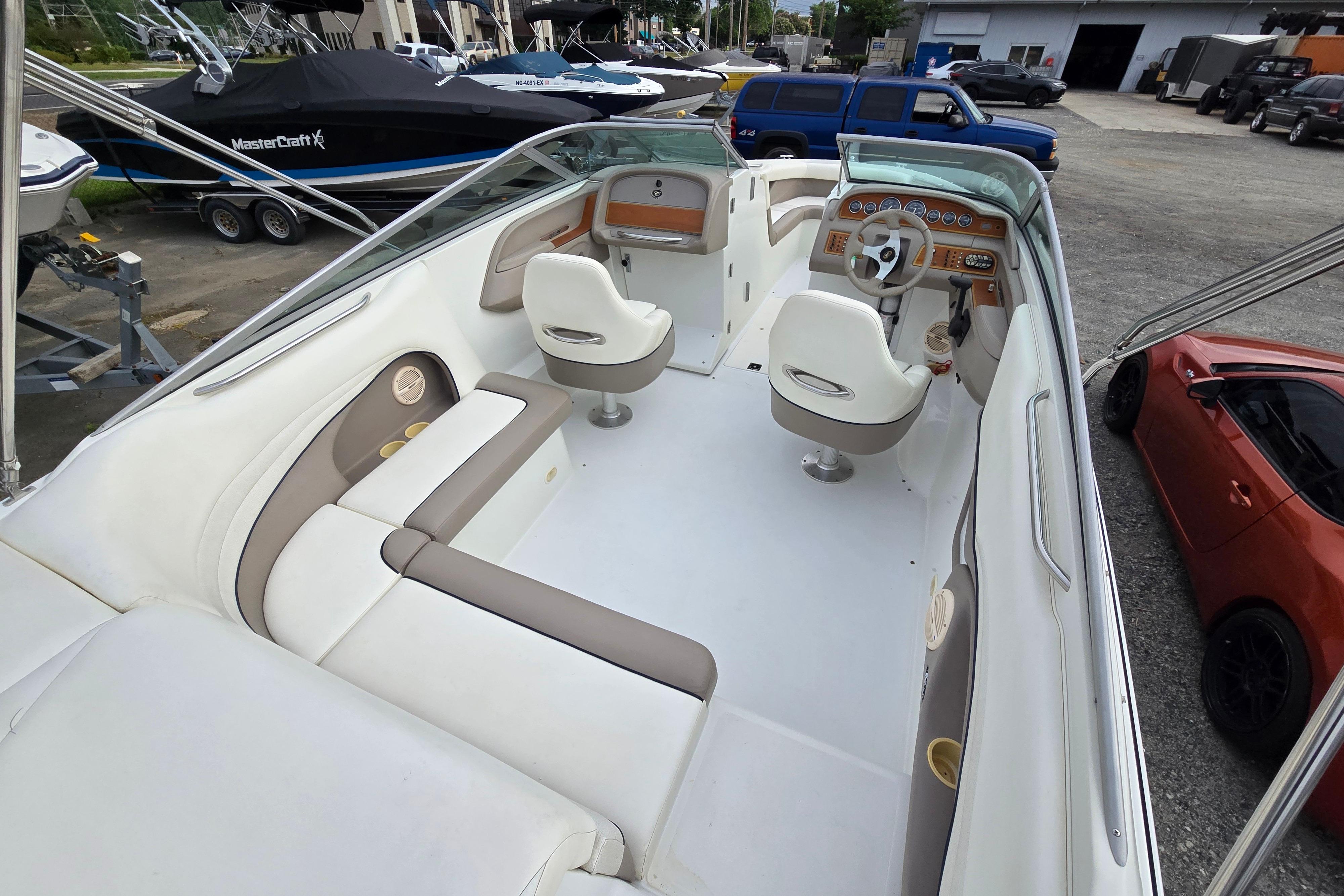 Interior of a 2000 Cobalt 246 boat with white and beige seating.