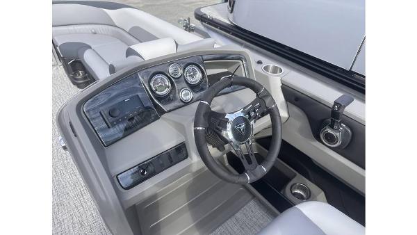 2025 Tahoe Pontoon LTZ Cruise dashboard with steering wheel and controls.