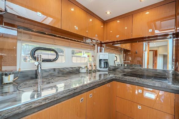 Luxurious kitchen interior of 2016 Sea Ray Sundancer 510 yacht with modern amenities.