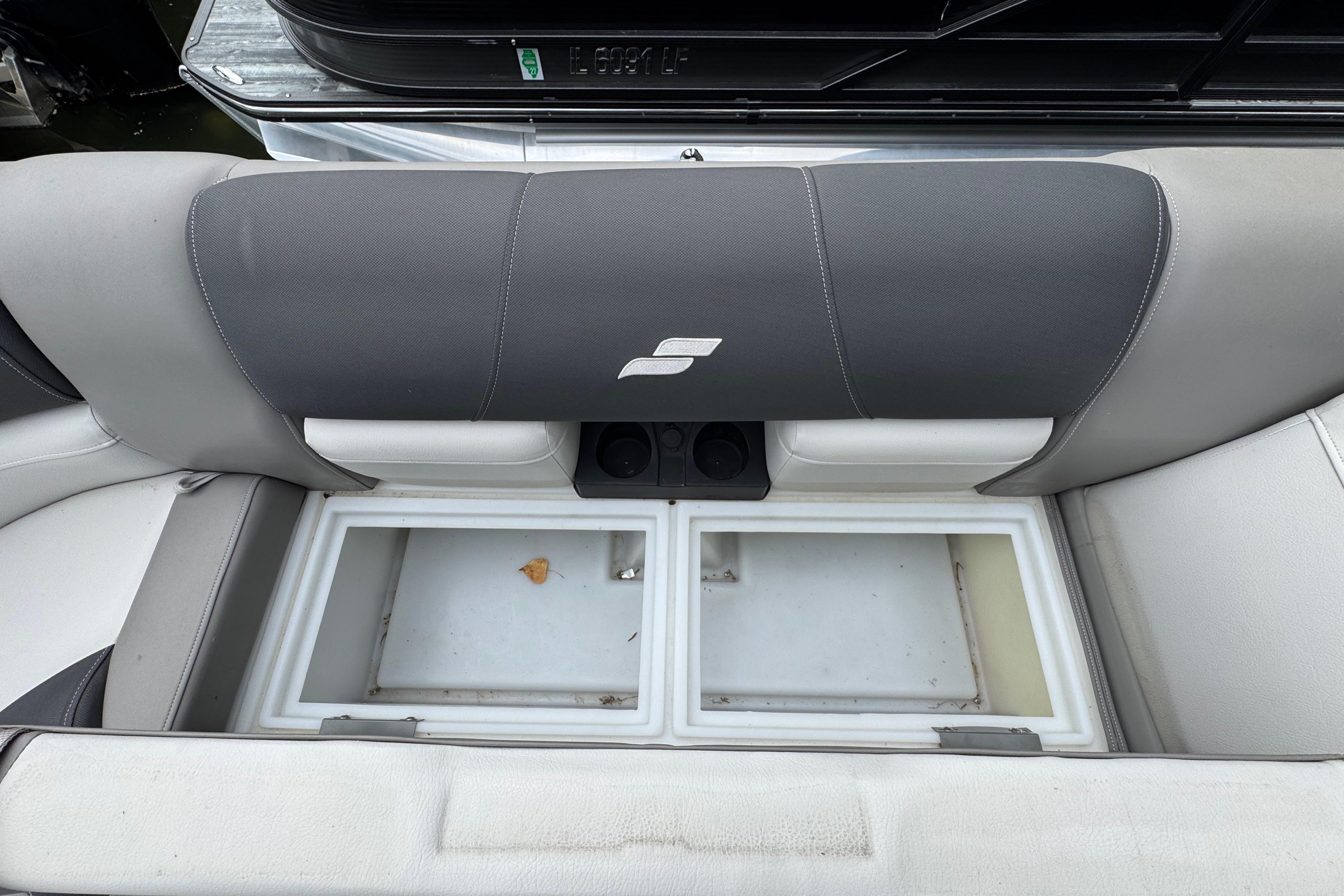 2023 Starcraft MX 25 DL DH boat seat with storage compartments open.