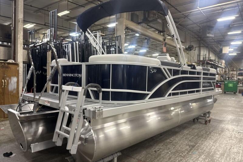 2026 Bennington 22 SSRSF pontoon boat in a factory setting.