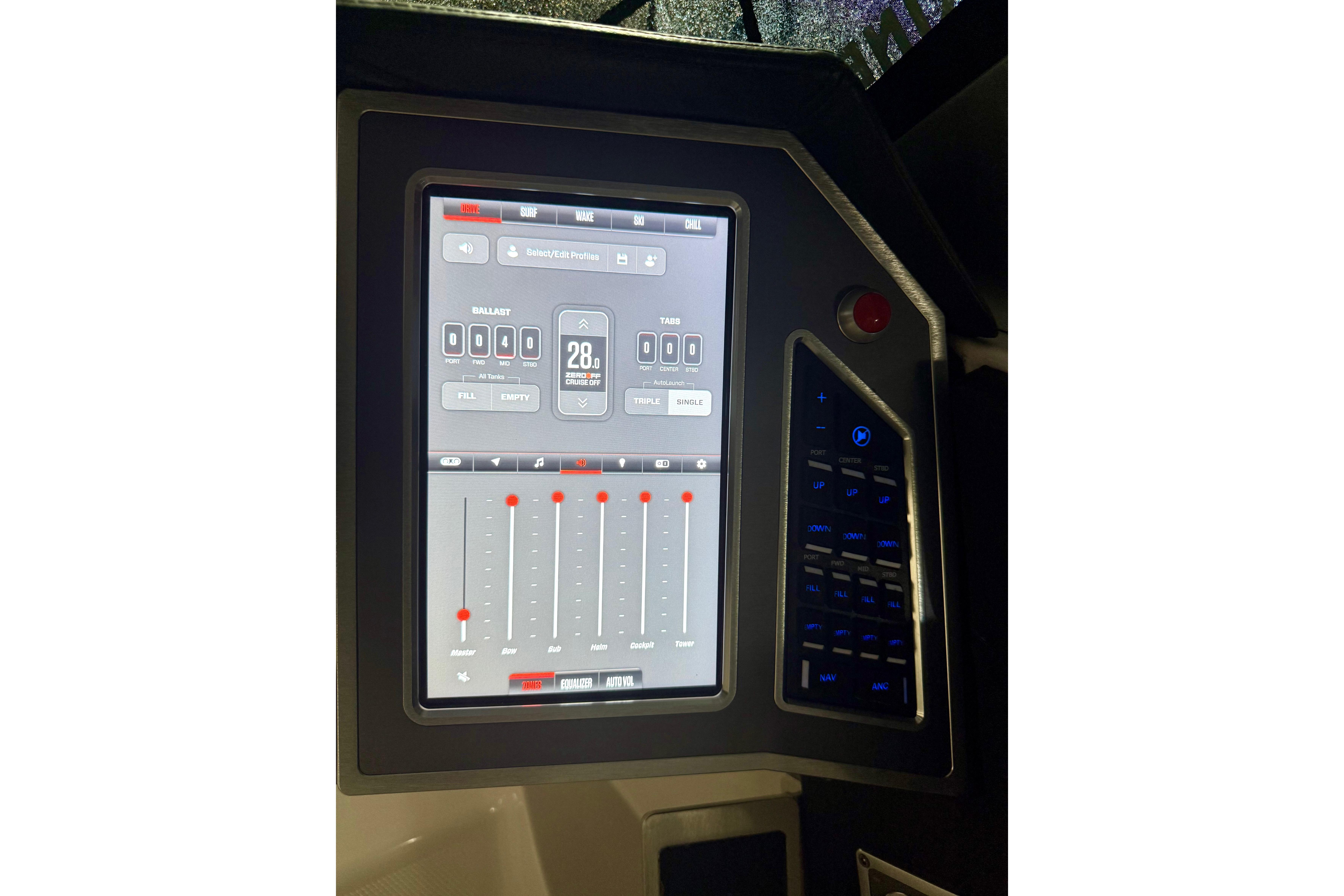 2023 MasterCraft X24 touchscreen control panel with digital interface and adjustment sliders.