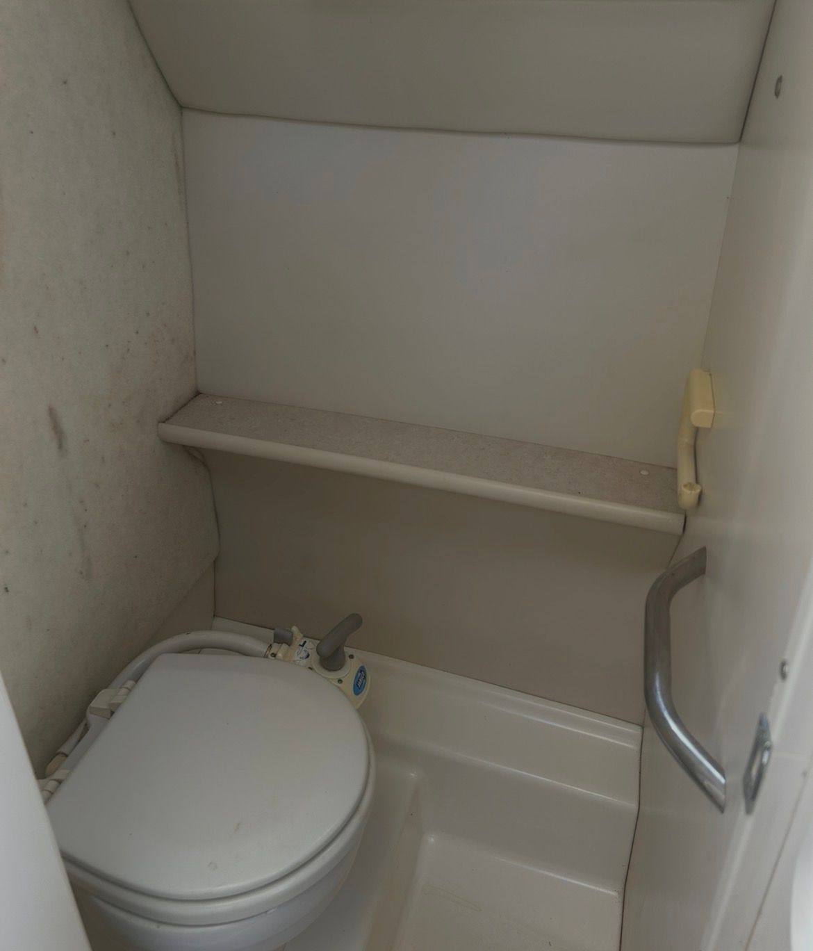 Bathroom in Bayliner Classic 242 boat, year 2005.