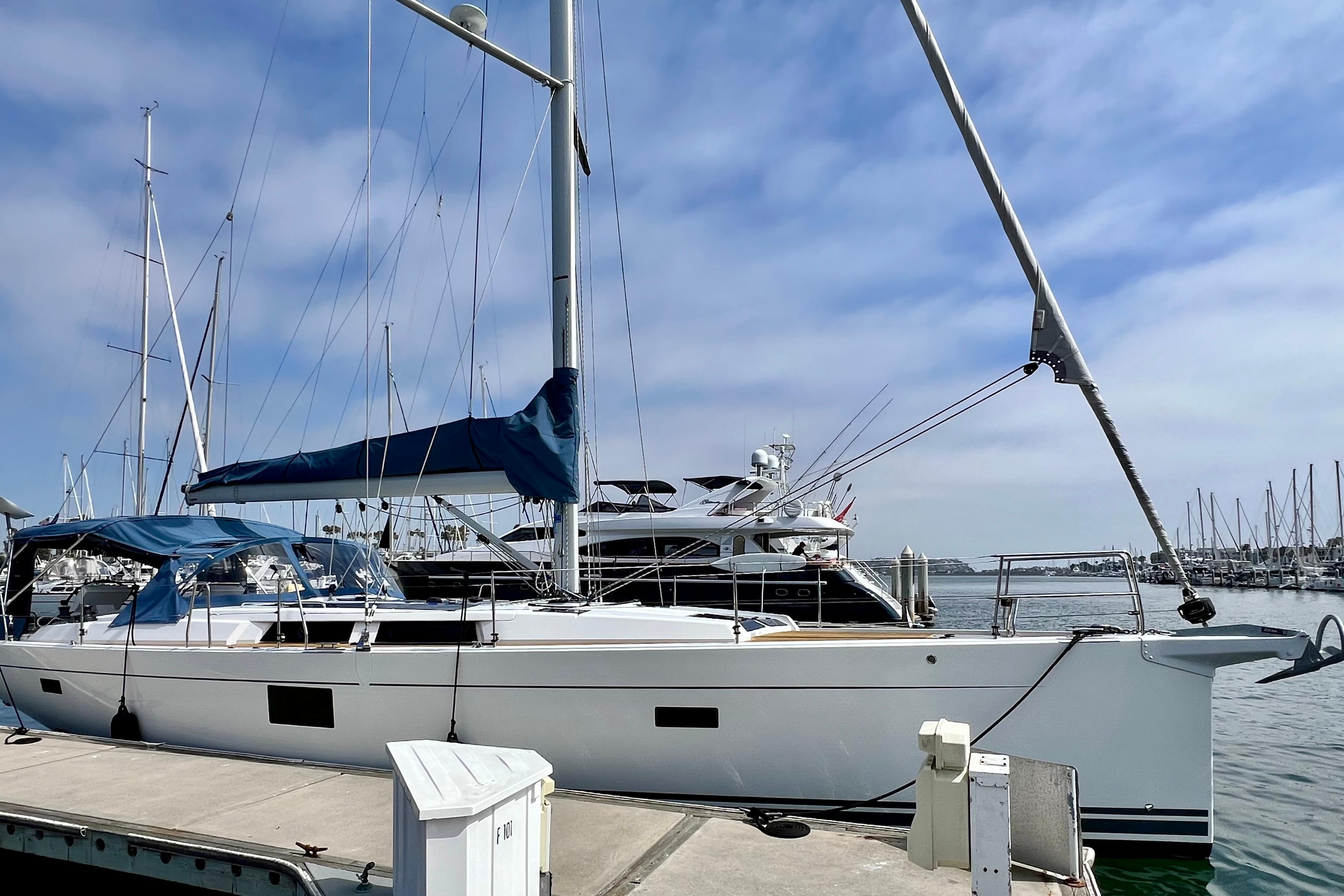 2016 Hanse 455 sailboat docked at marina under clear blue sky.