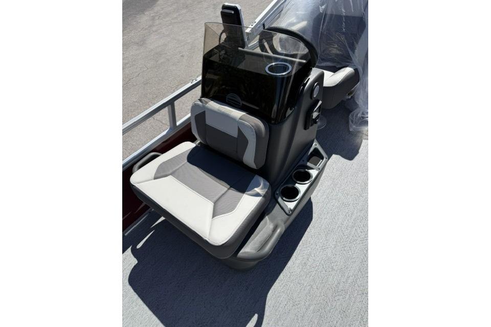 2026 Sun Tracker Bass Buggy 16 XL Select boat seat with console and cup holders.