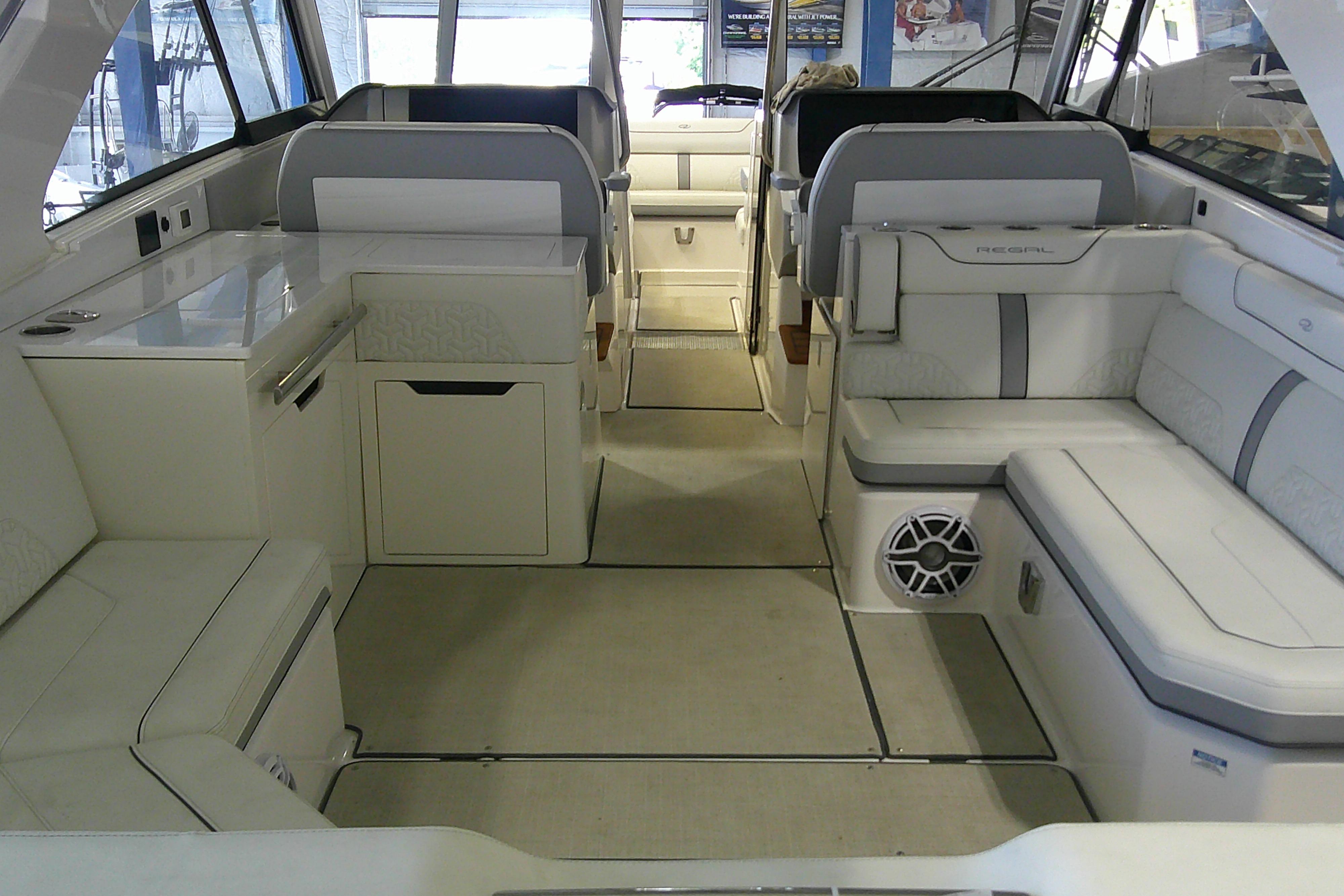 Luxurious interior of 2023 Regal LX36 boat, featuring elegant seating and modern amenities.