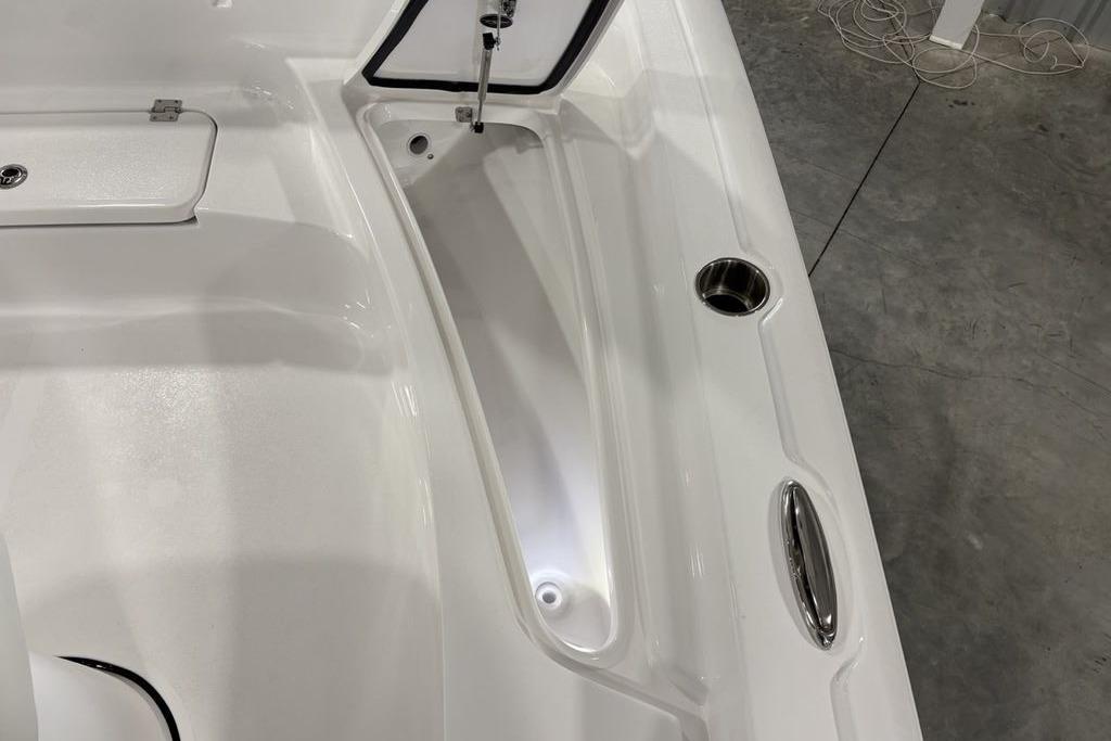 2026 Tidewater 2210 Carolina Bay boat interior with storage compartment and cup holder.