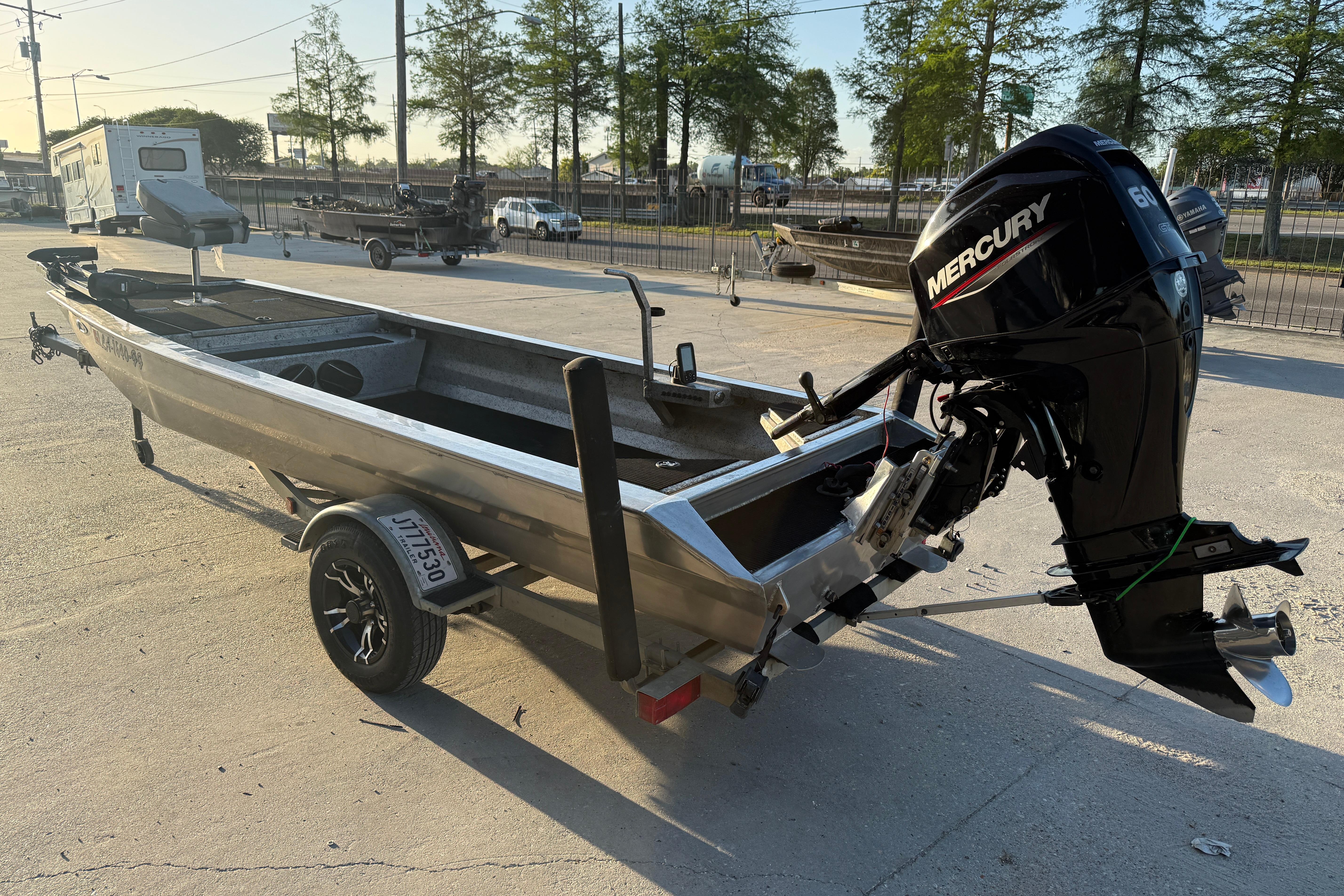 2017 Homemade 1754 boat with Mercury outboard motor on trailer in outdoor setting.