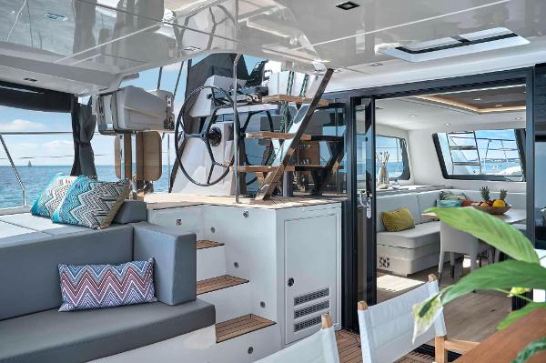 Luxurious interior of 2025 Privilege Signature 580 yacht with modern seating and ocean view.