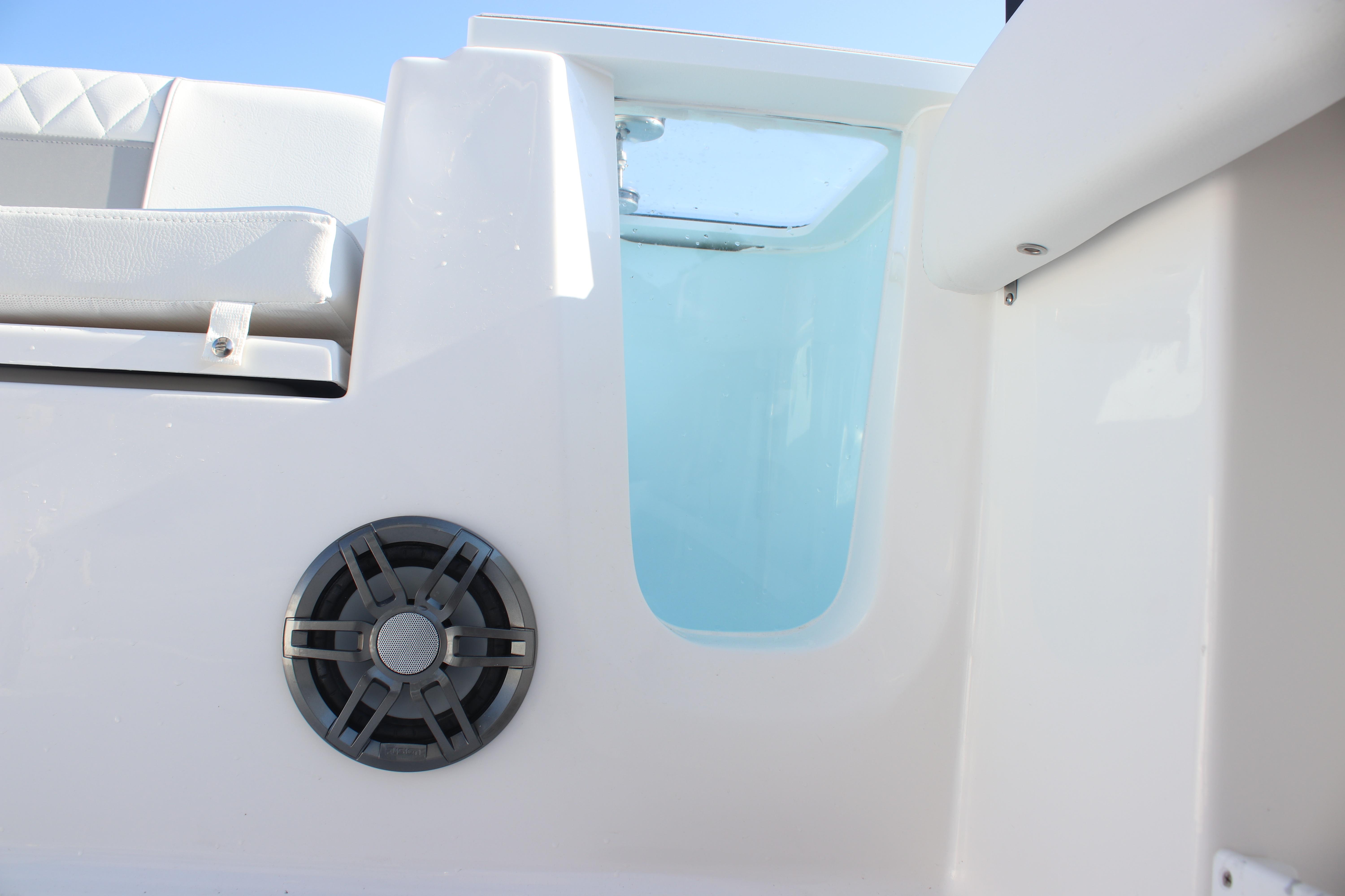 2026 Sea Fox 248 Commander boat interior with speaker and seating detail.