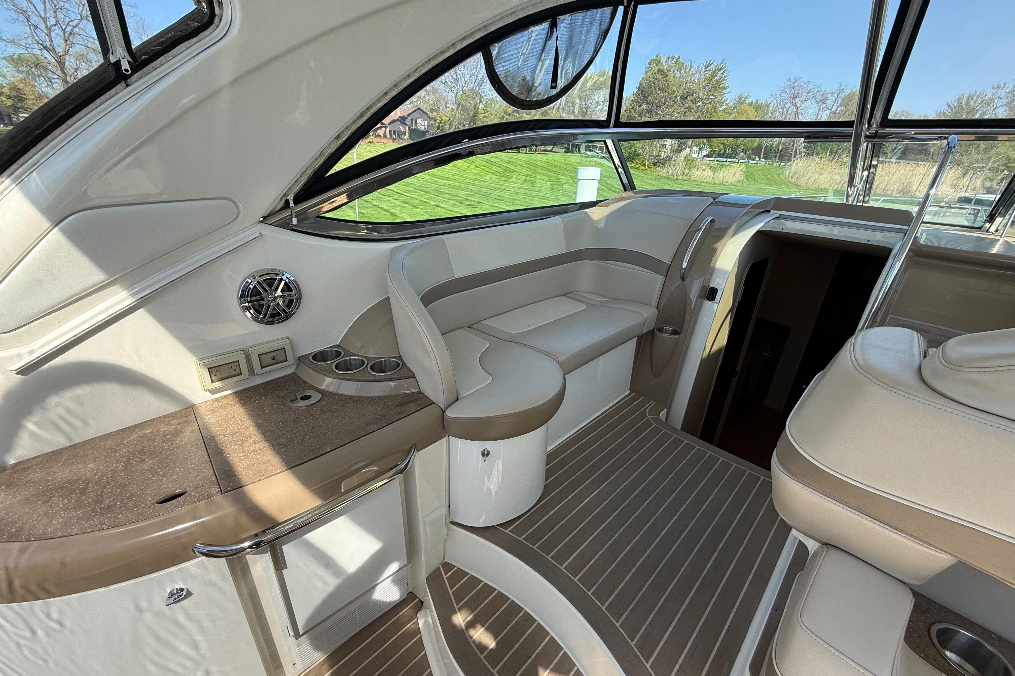 2014 Formula 37 Performance Cruiser interior with beige seating and wood accents.
