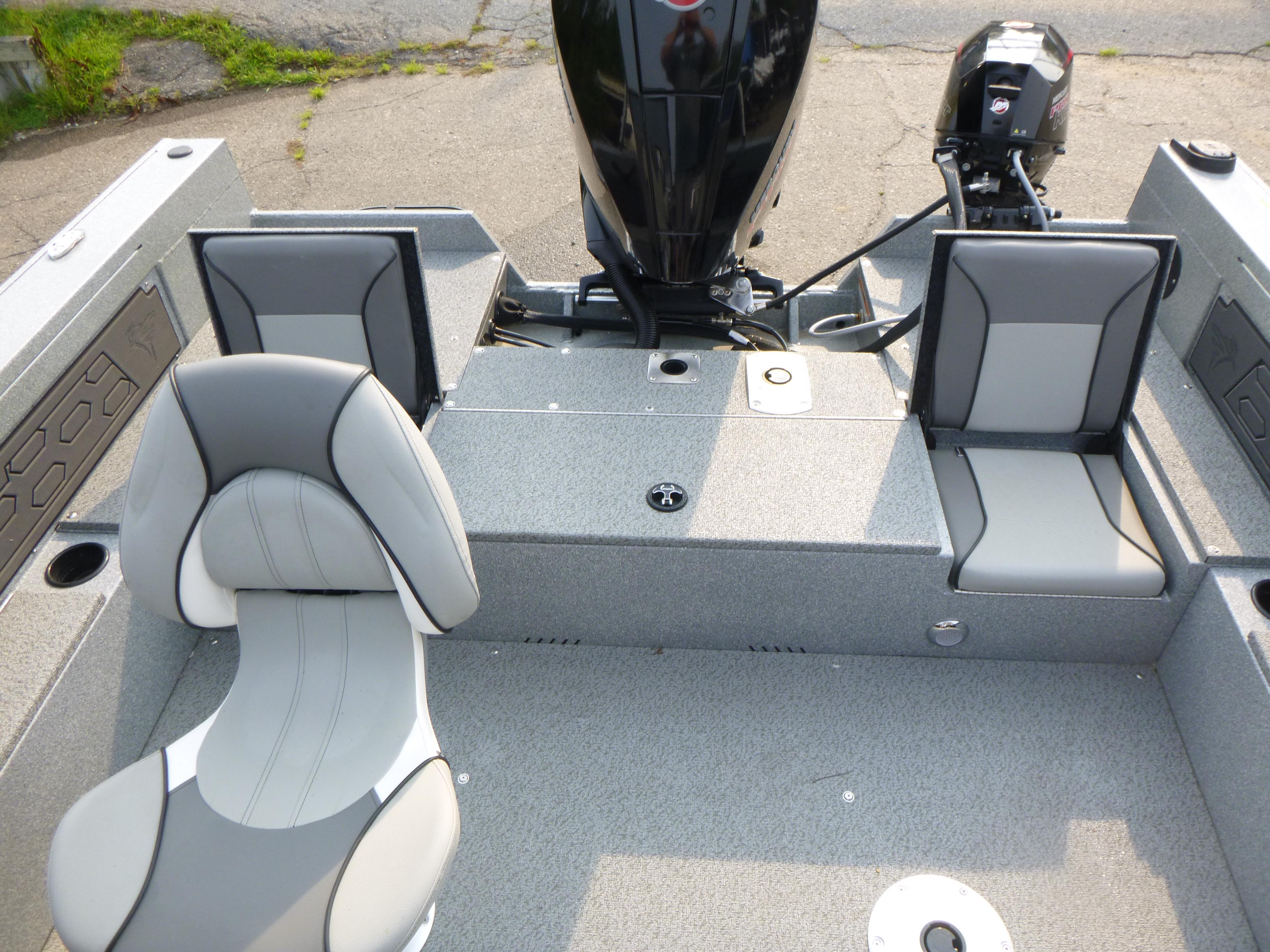 2025 KingFisher 2125 Arrow Sport boat interior with gray seating and motor.