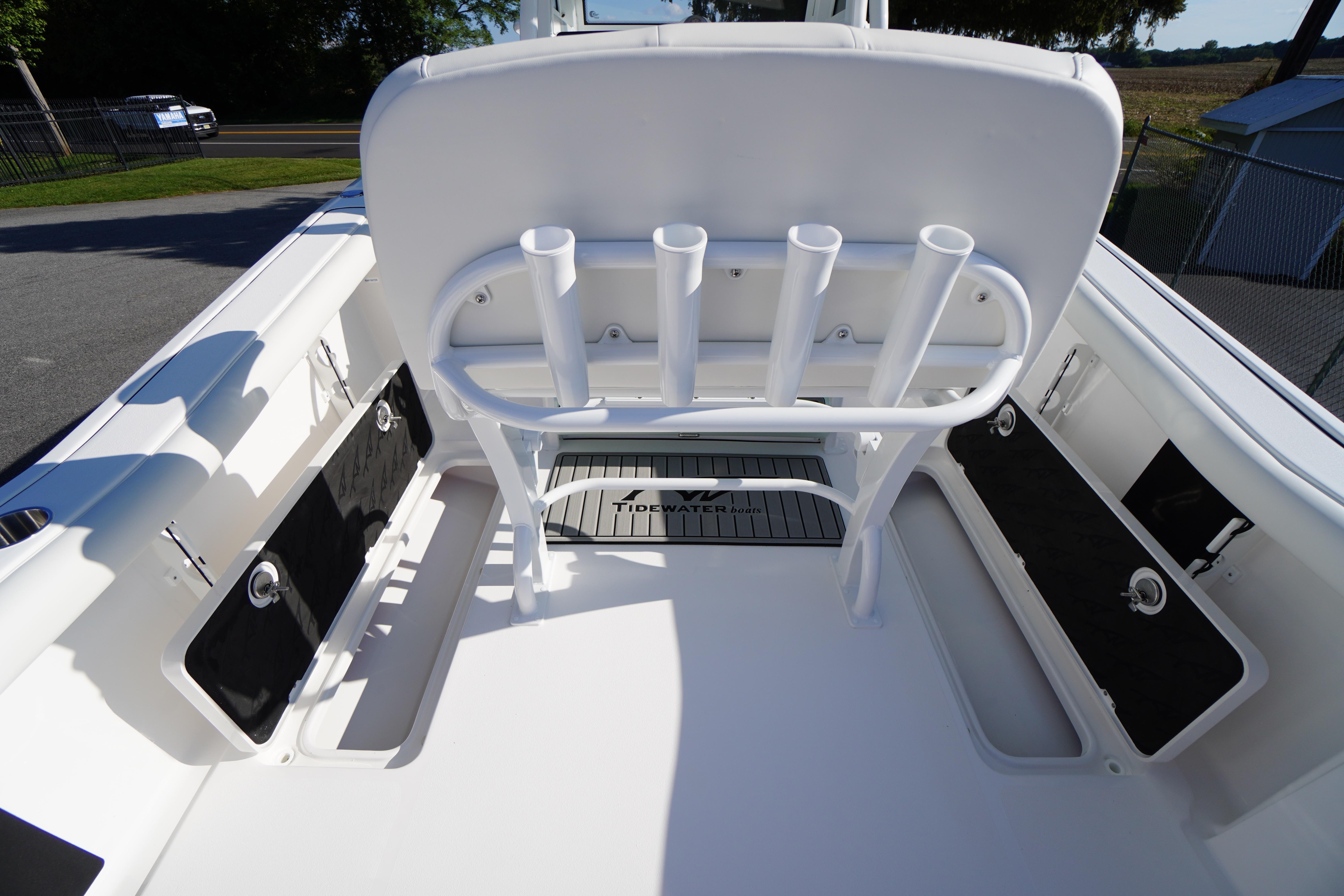 2026 Tidewater 272 LXF boat interior with rod holders and storage compartments.