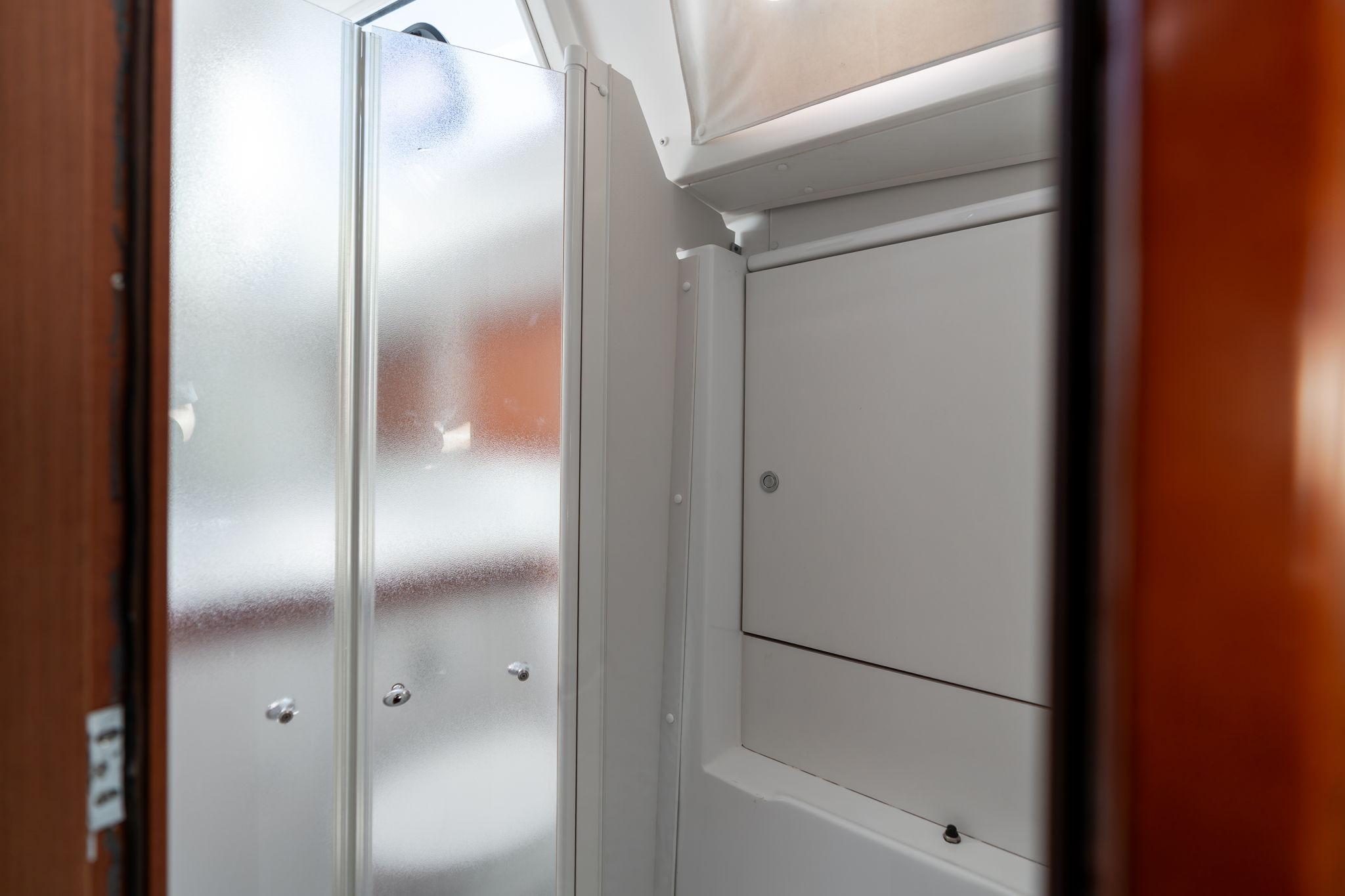 Beneteau Oceanis 50 yacht bathroom with frosted glass shower, 2013 model.