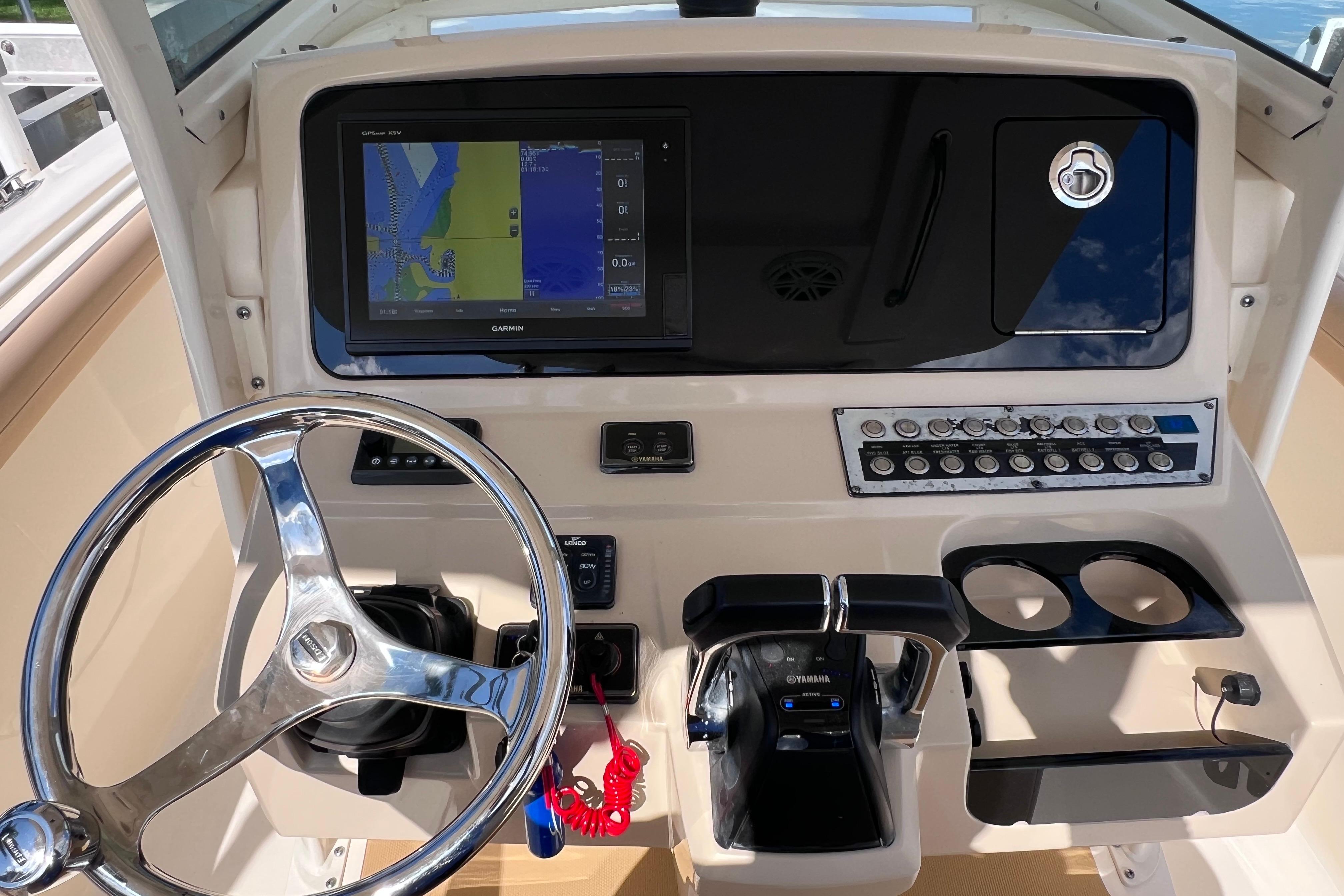 2019 Scout 275 LXF boat dashboard with Garmin display and Yamaha controls.